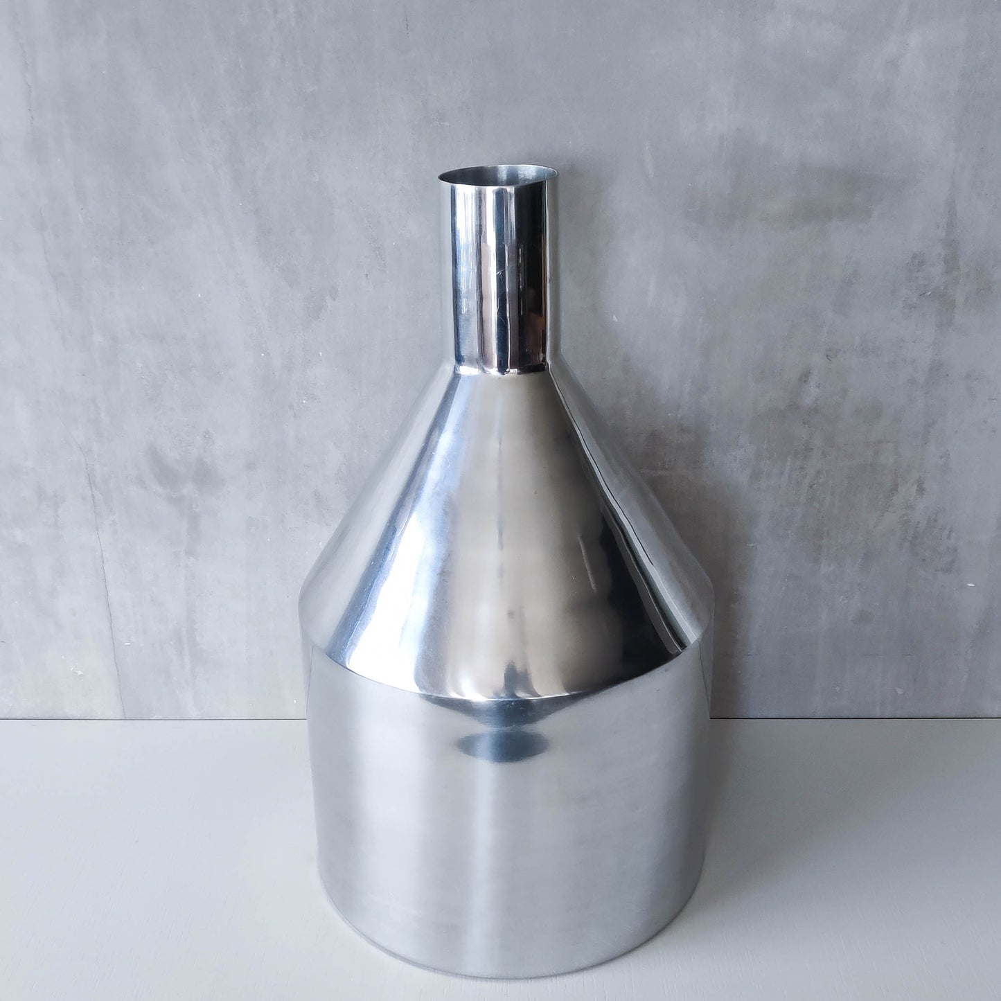Large cast aluminium sculptural funnel shaped vase