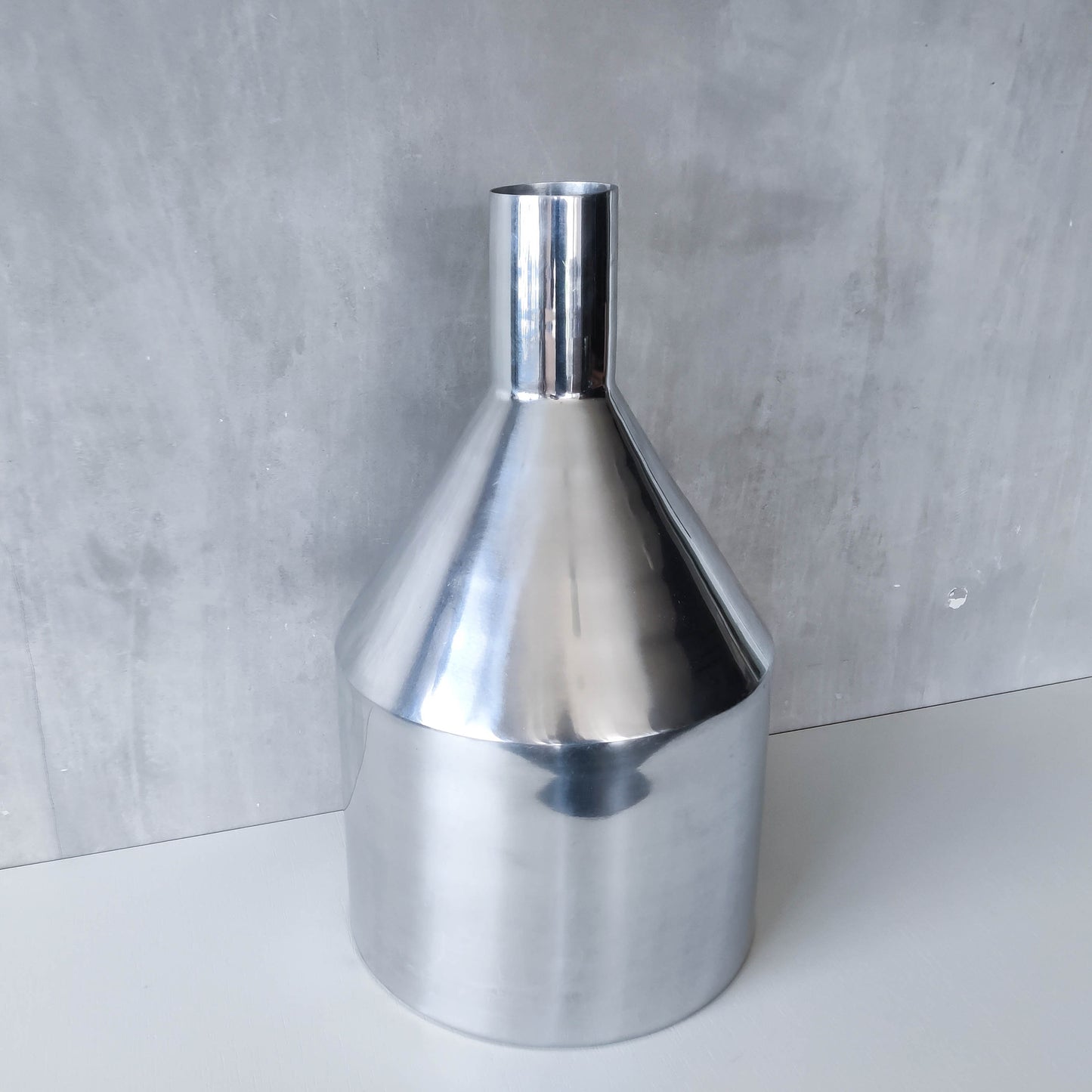 Large cast aluminium sculptural funnel shaped vase