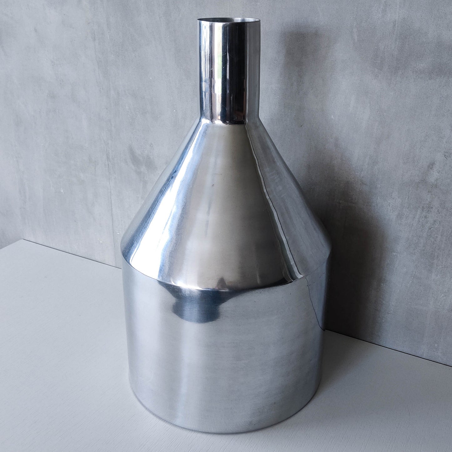 Large cast aluminium sculptural funnel shaped vase