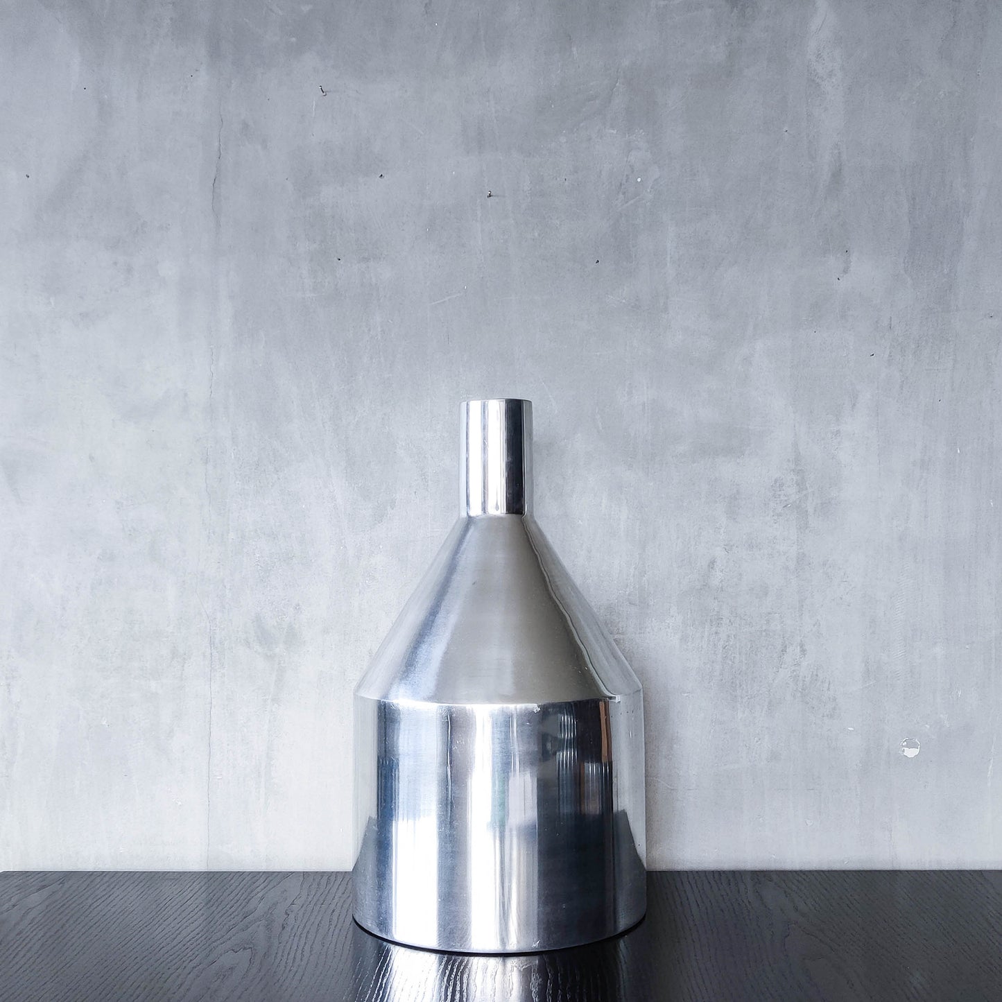 Large cast aluminium sculptural funnel shaped vase