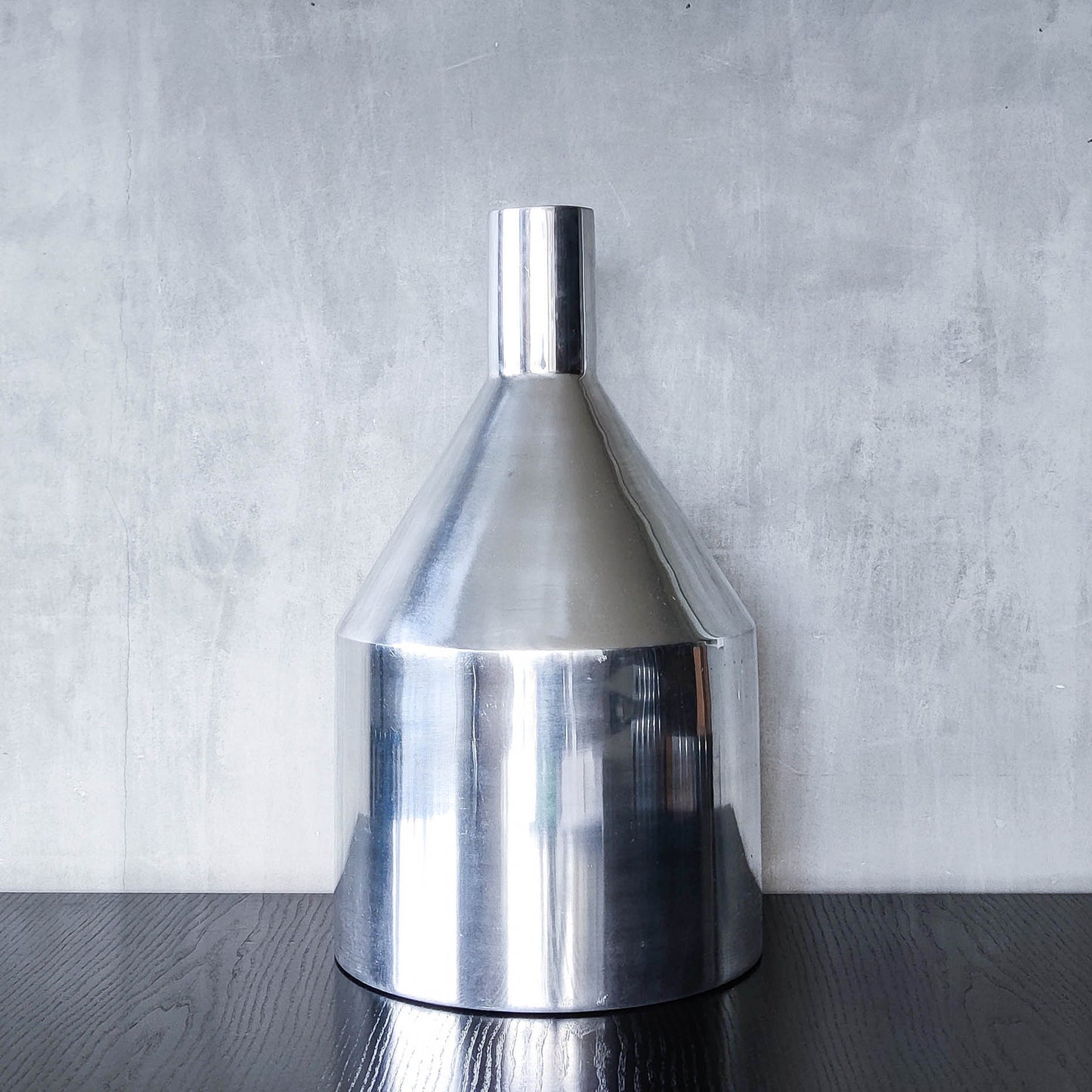 Large cast aluminium sculptural funnel shaped vase