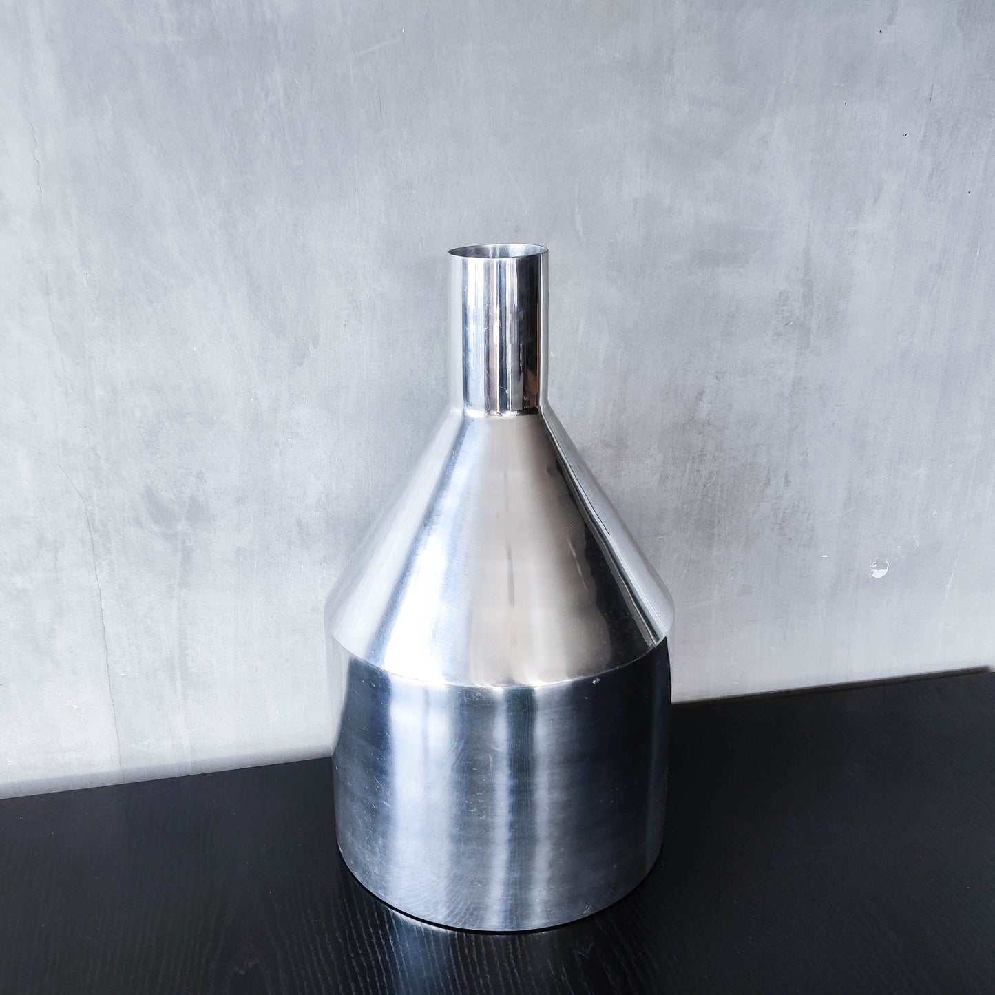 Large cast aluminium sculptural funnel shaped vase