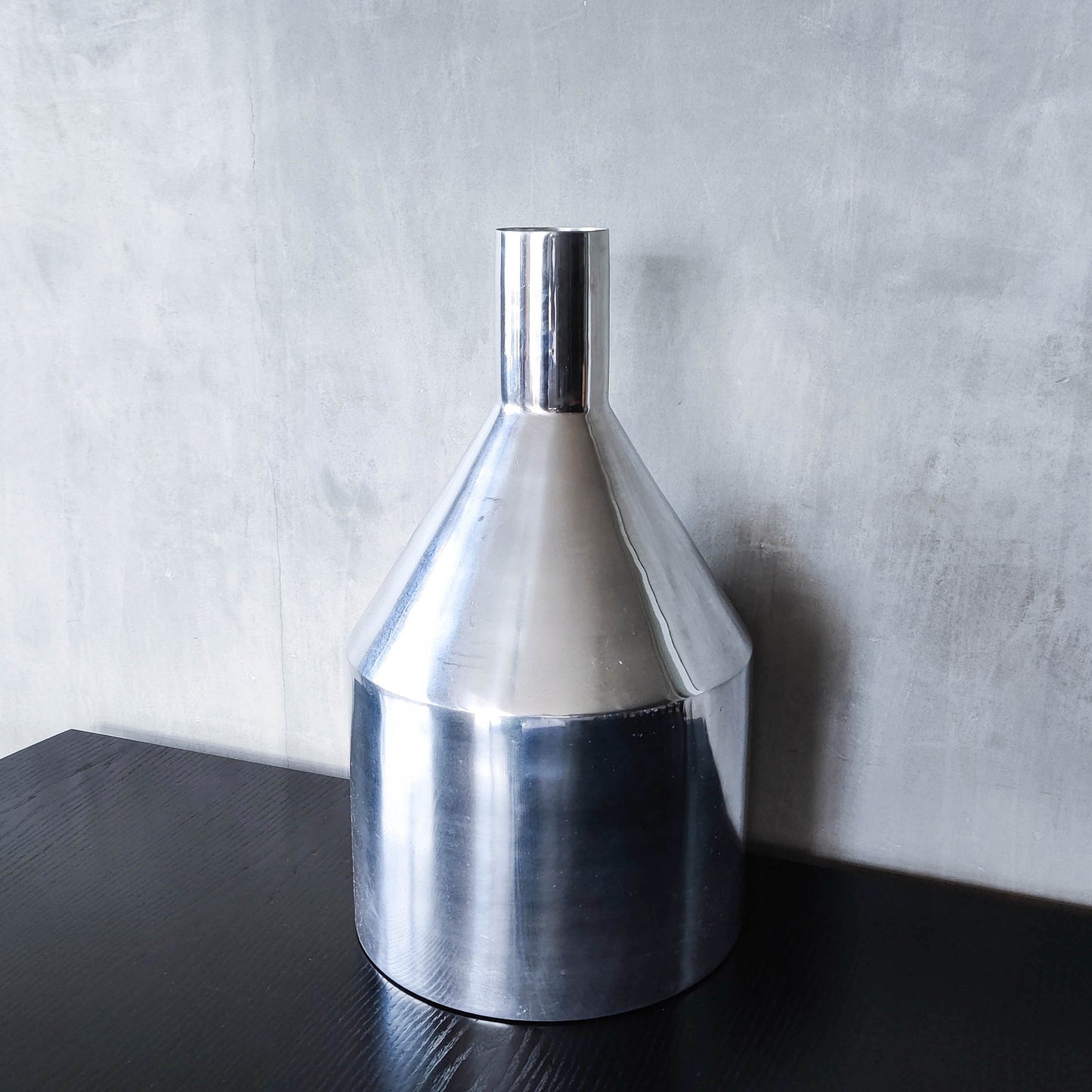 Large cast aluminium sculptural funnel shaped vase