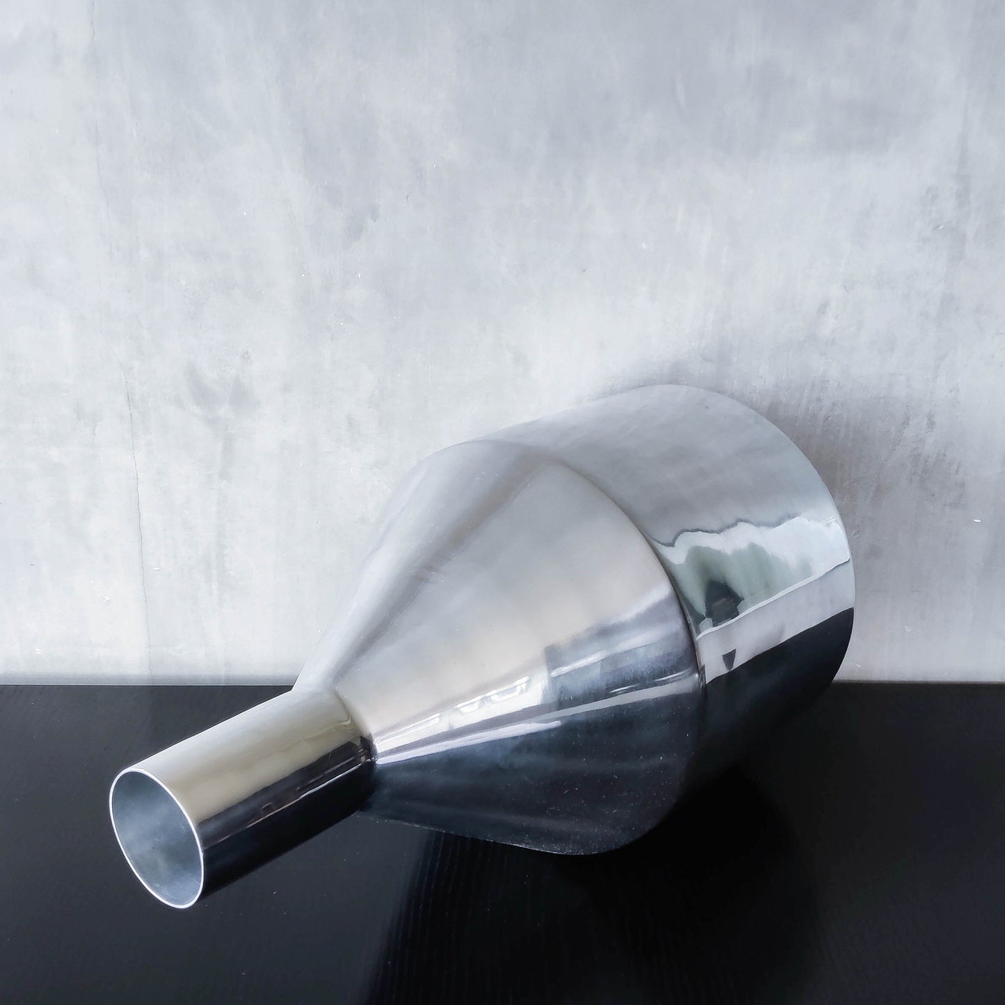 Large cast aluminium sculptural funnel shaped vase