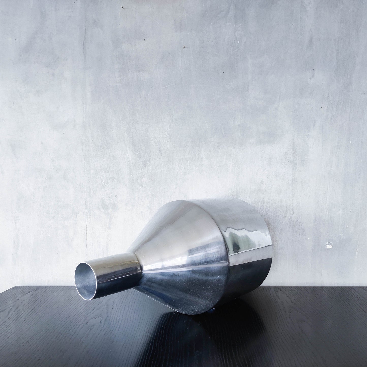 Large cast aluminium sculptural funnel shaped vase