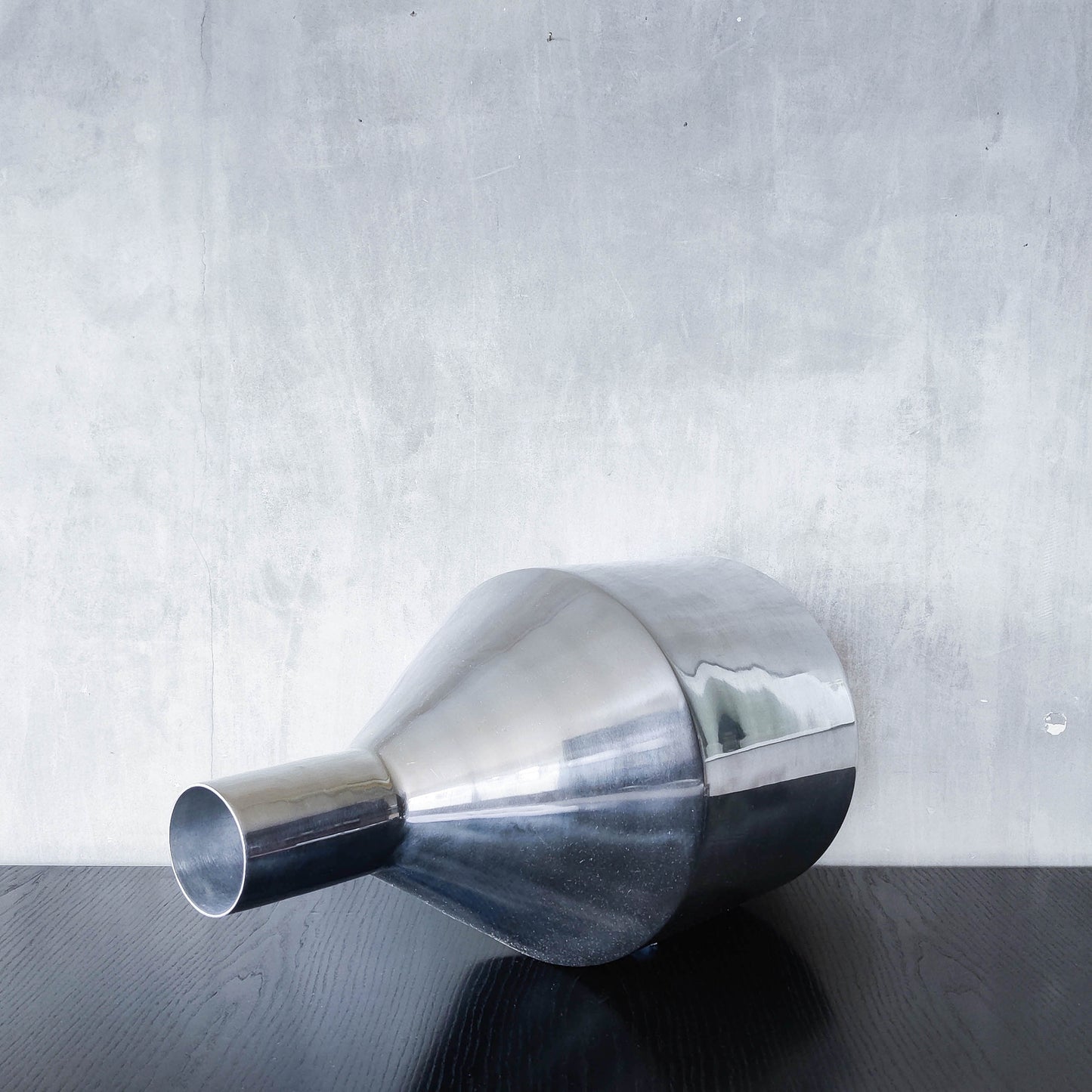 Large cast aluminium sculptural funnel shaped vase