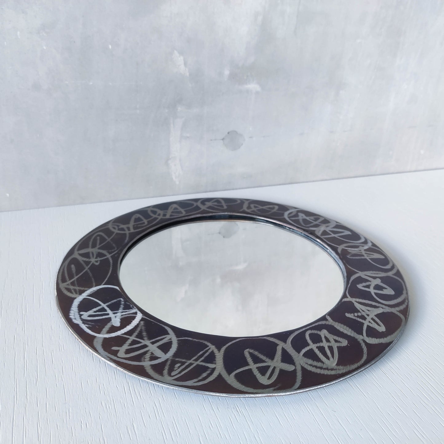 Vintage 1990s artisan made metalwork round steel mirror