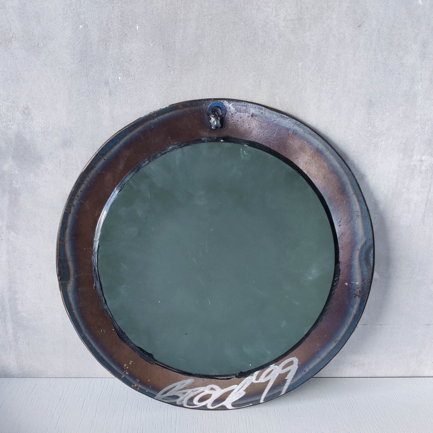 Vintage 1990s artisan made metalwork round steel mirror