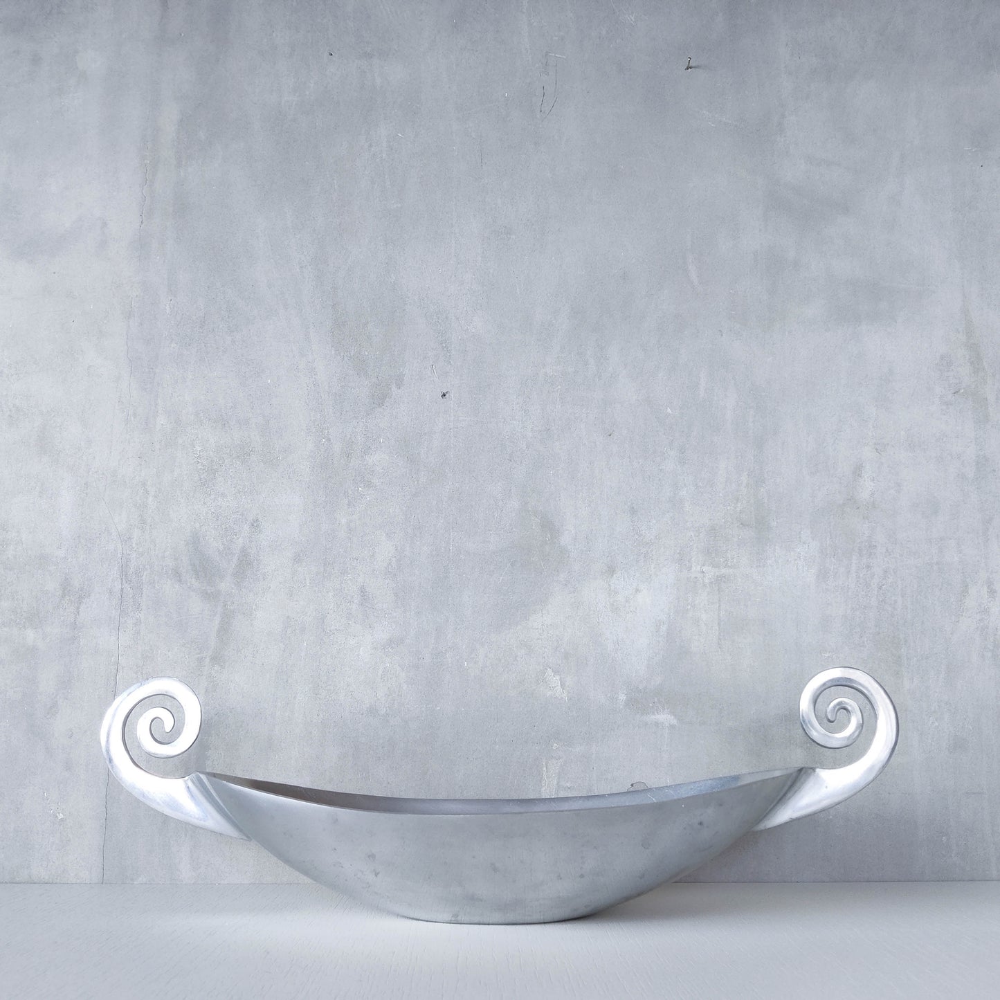 Vintage 1990s large sculptural spiral scroll boat shaped cast aluminium centrepiece bowl
