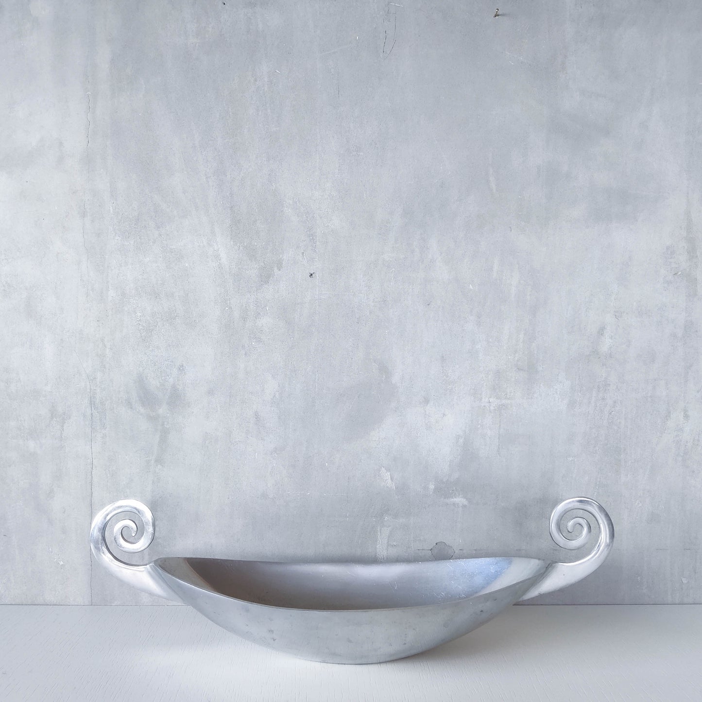 Vintage 1990s large sculptural spiral scroll boat shaped cast aluminium centrepiece bowl