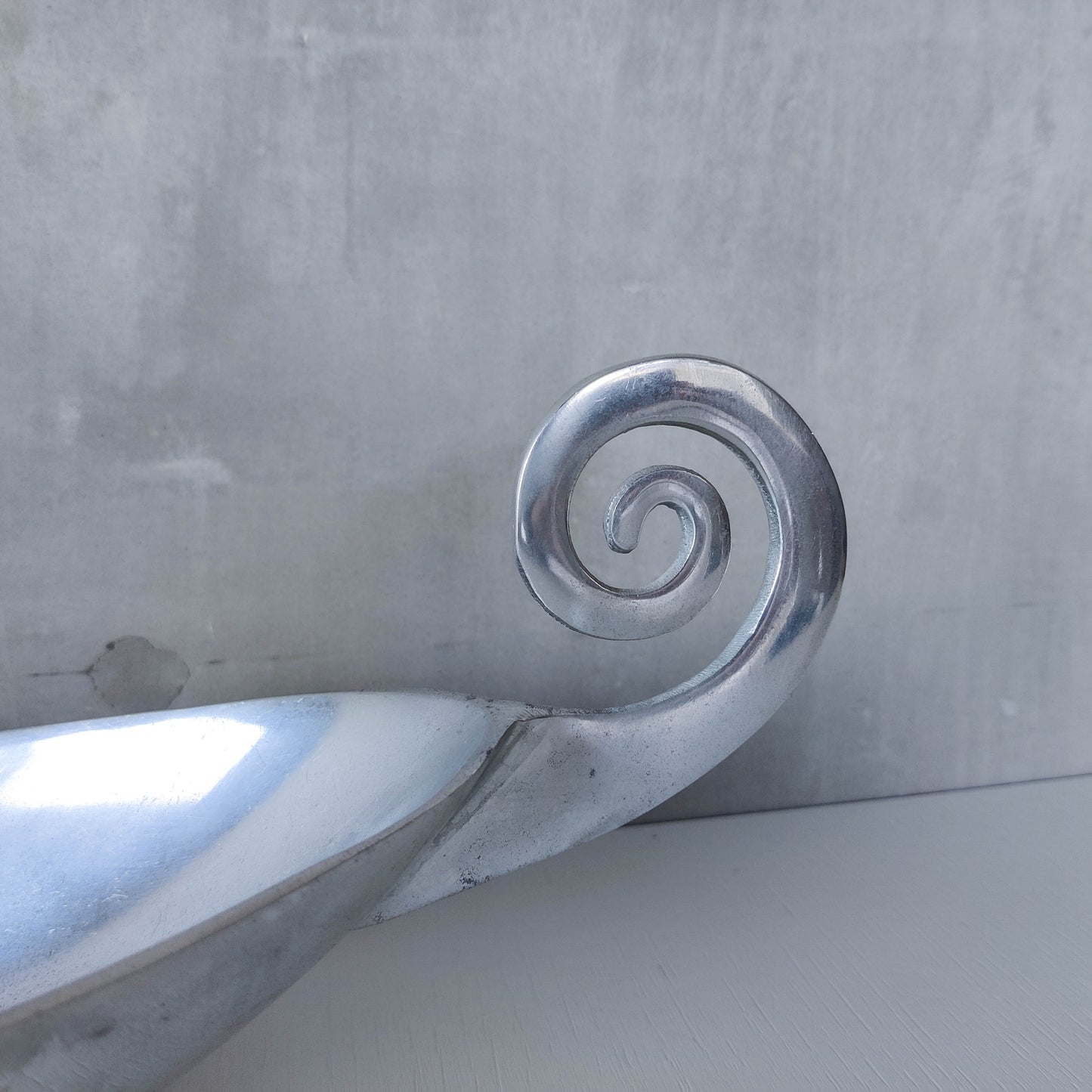 Vintage 1990s large sculptural spiral scroll boat shaped cast aluminium centrepiece bowl