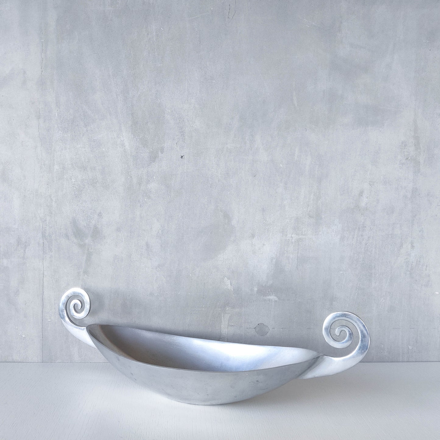 Vintage 1990s large sculptural spiral scroll boat shaped cast aluminium centrepiece bowl