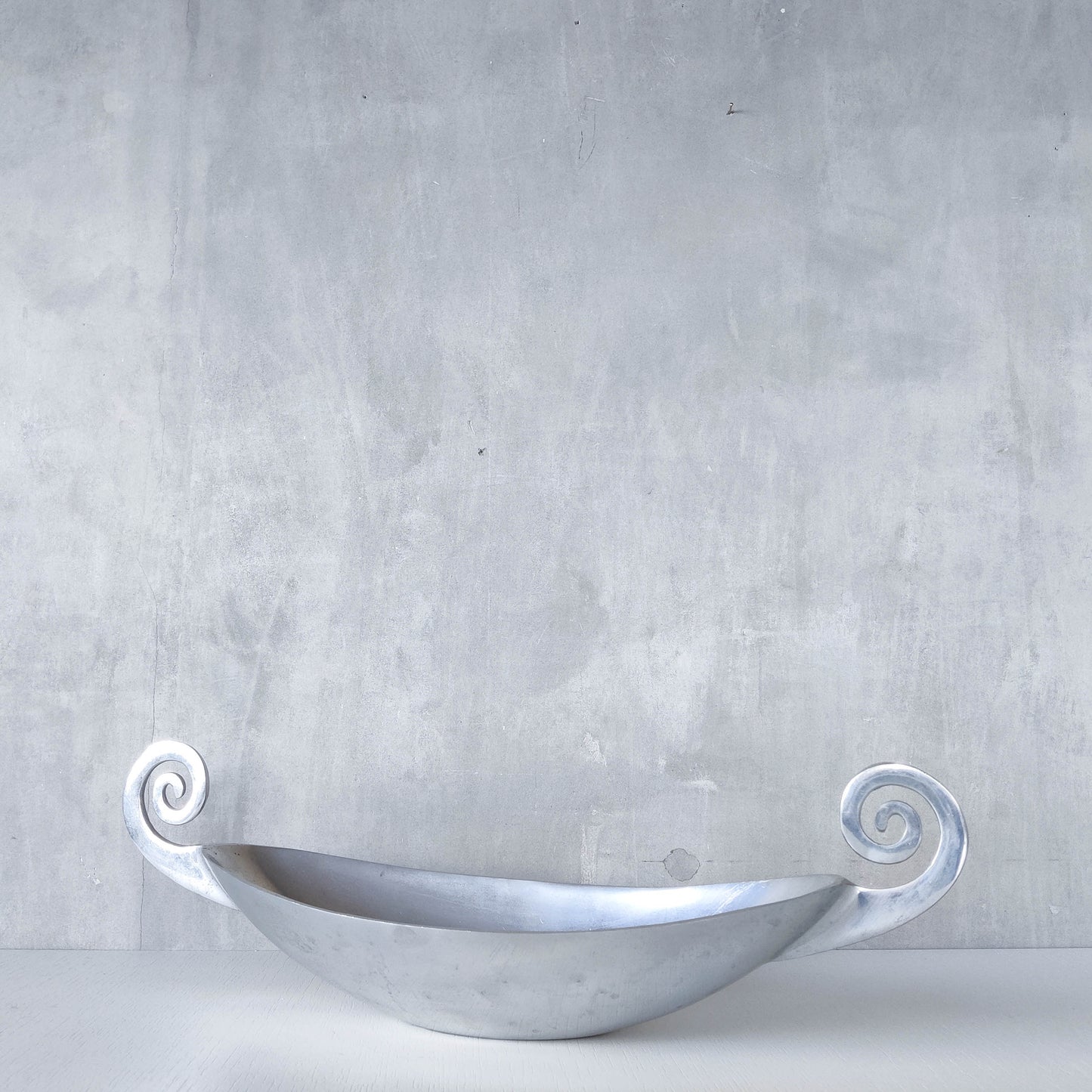 Vintage 1990s large sculptural spiral scroll boat shaped cast aluminium centrepiece bowl
