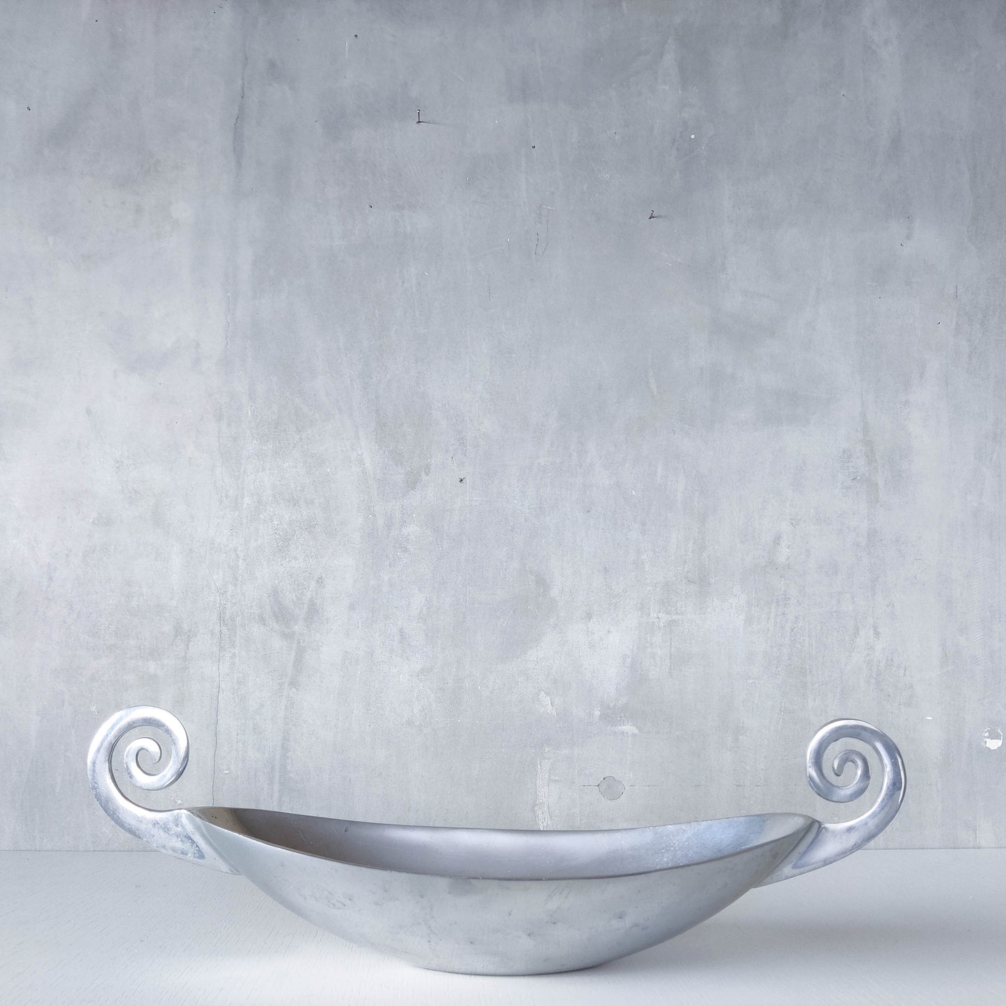 Vintage 1990s large sculptural spiral scroll boat shaped cast aluminium centrepiece bowl