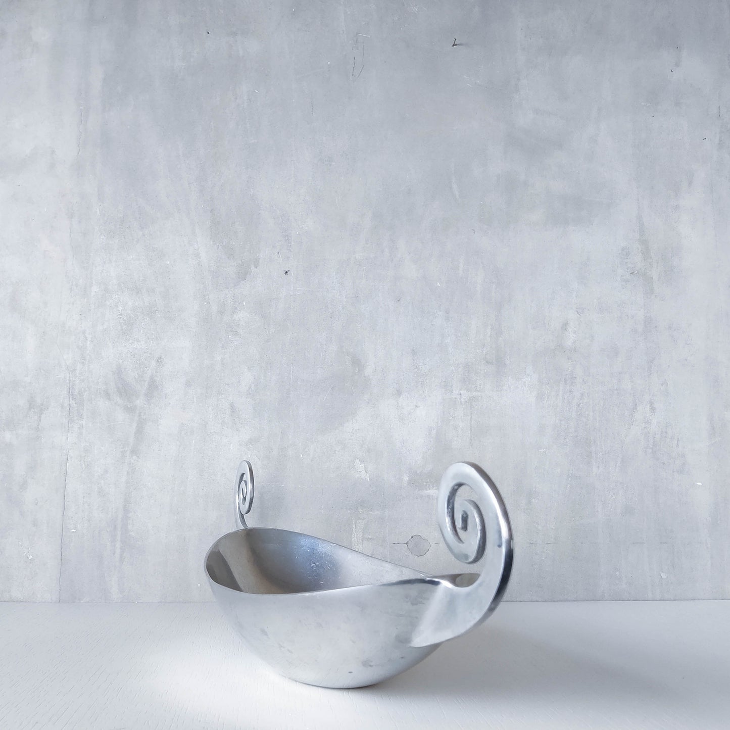 Vintage 1990s large sculptural spiral scroll boat shaped cast aluminium centrepiece bowl