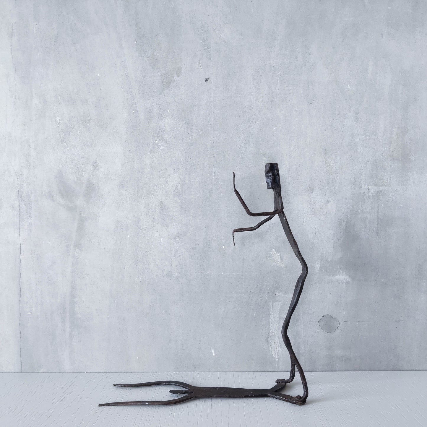 Brutalist wrought iron handmade figure with shadow sculpture or single bookend