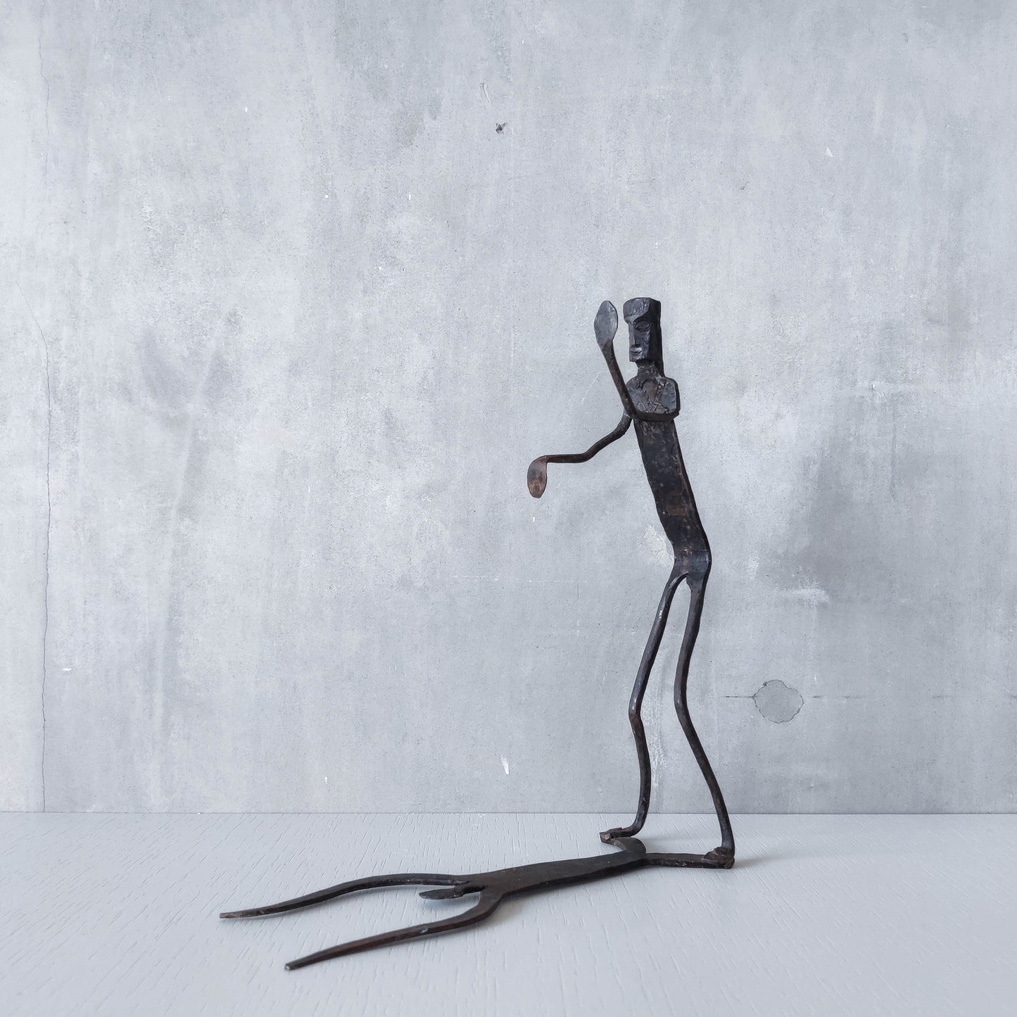 Brutalist wrought iron handmade figure with shadow sculpture or single bookend