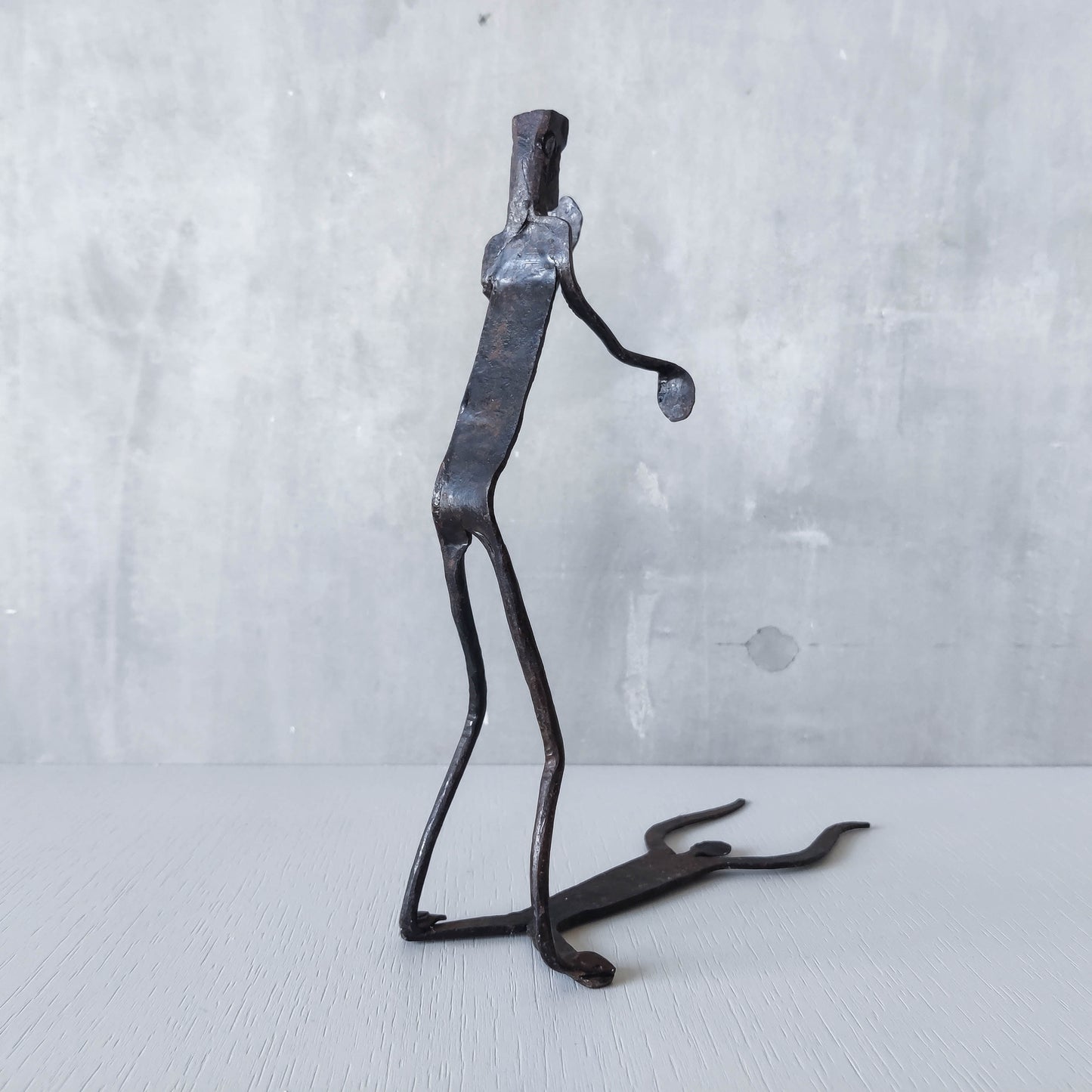 Brutalist wrought iron handmade figure with shadow sculpture or single bookend