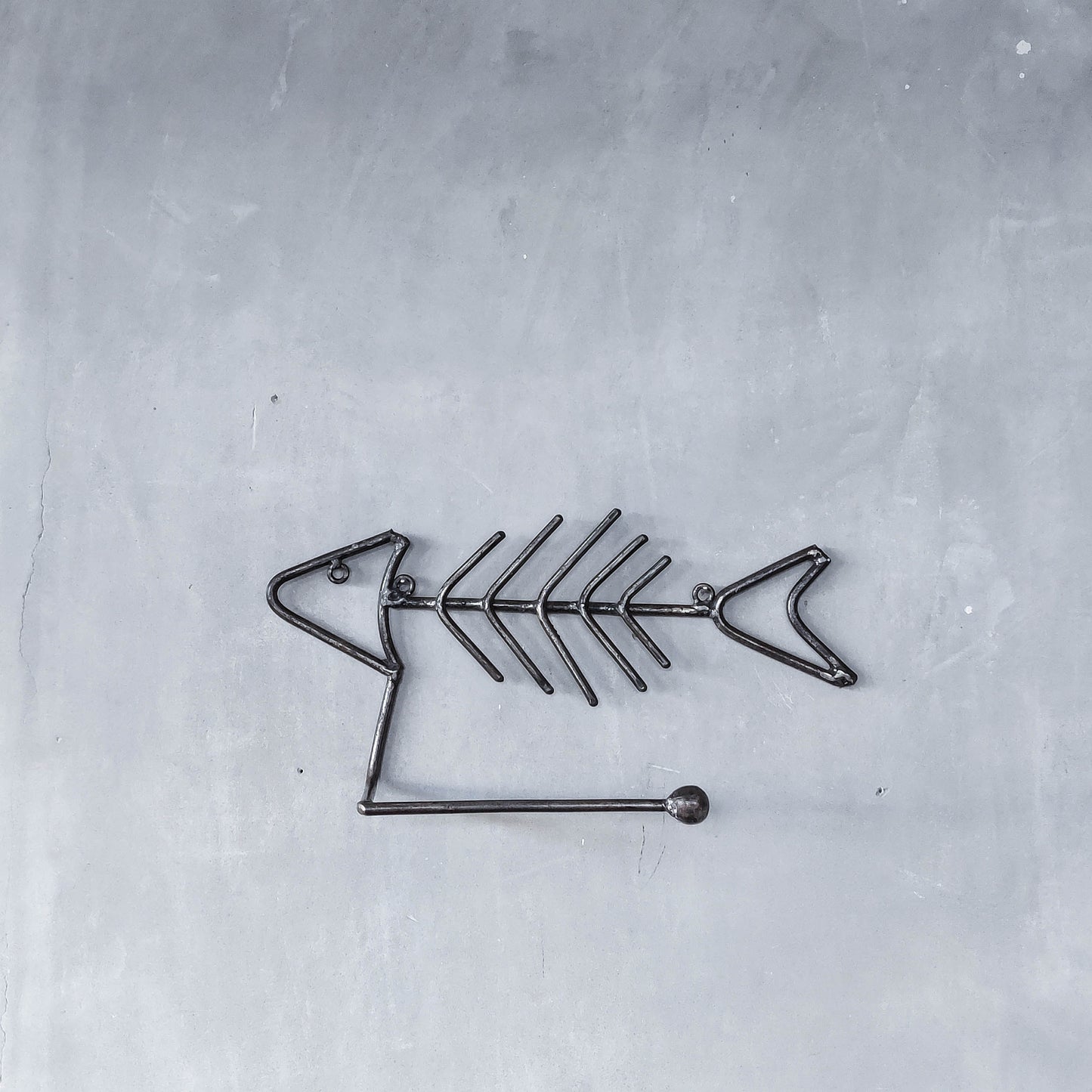 Vintage artisan made metalwork welded steel fish skeleton toilet roll holder