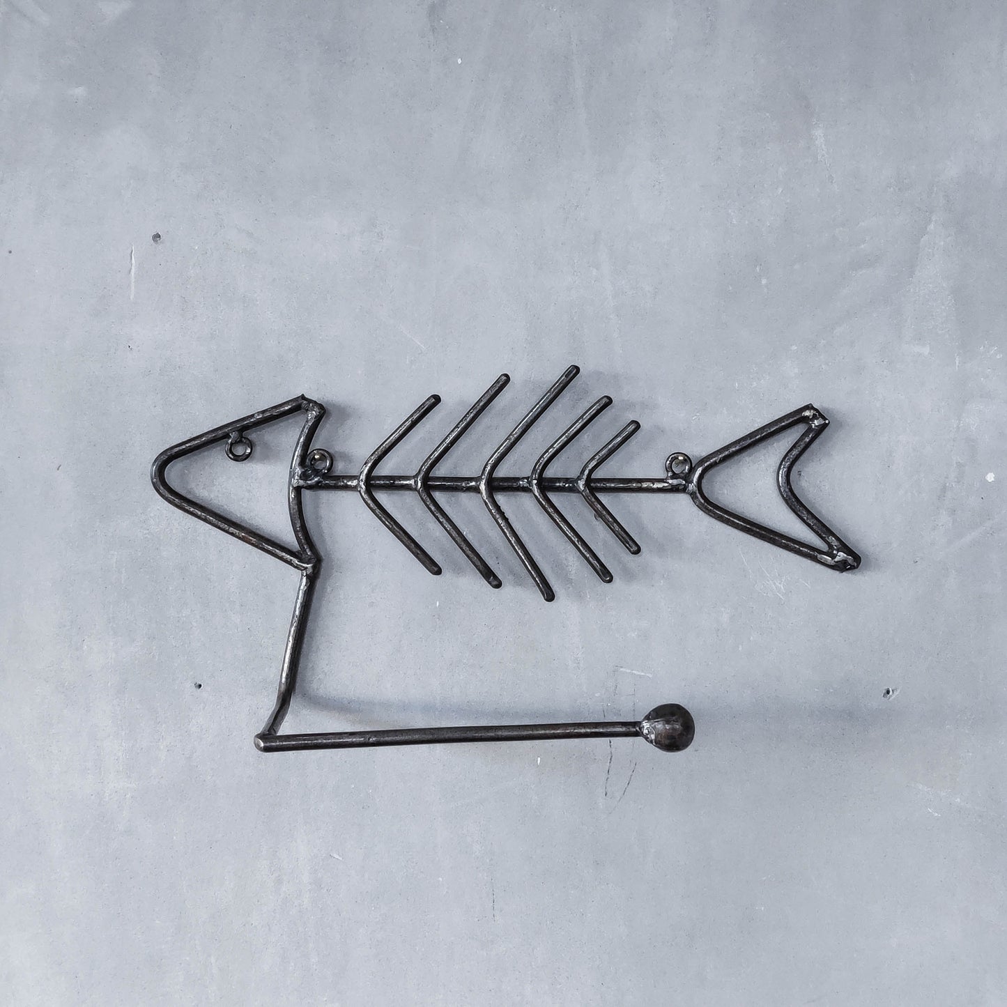 Vintage artisan made metalwork welded steel fish skeleton toilet roll holder