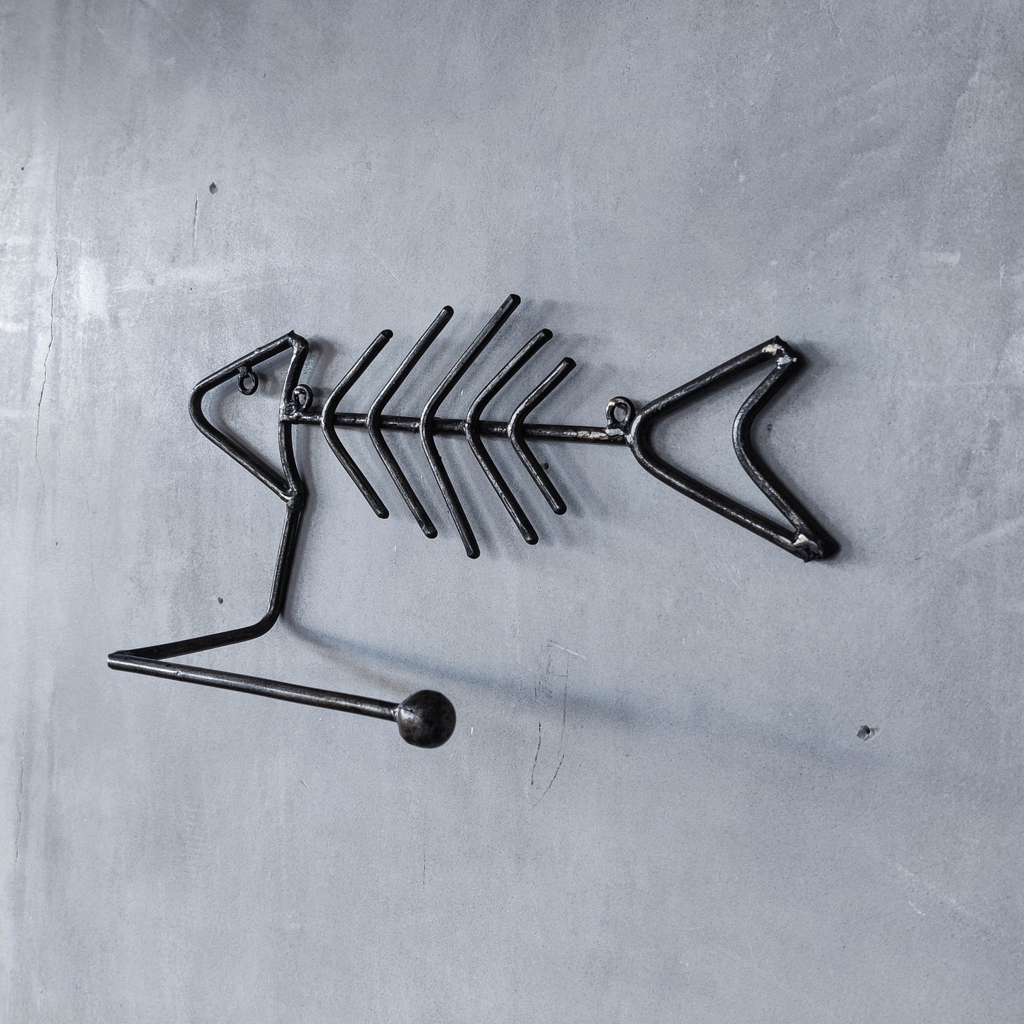 Vintage artisan made metalwork welded steel fish skeleton toilet roll holder