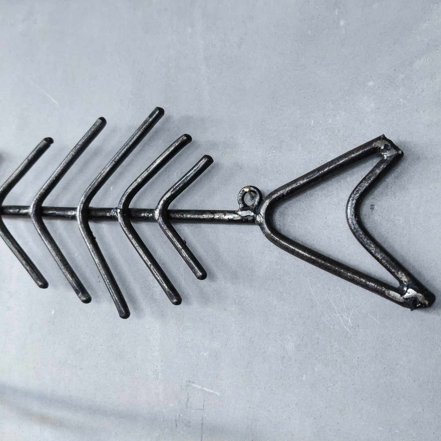 Vintage artisan made metalwork welded steel fish skeleton toilet roll holder