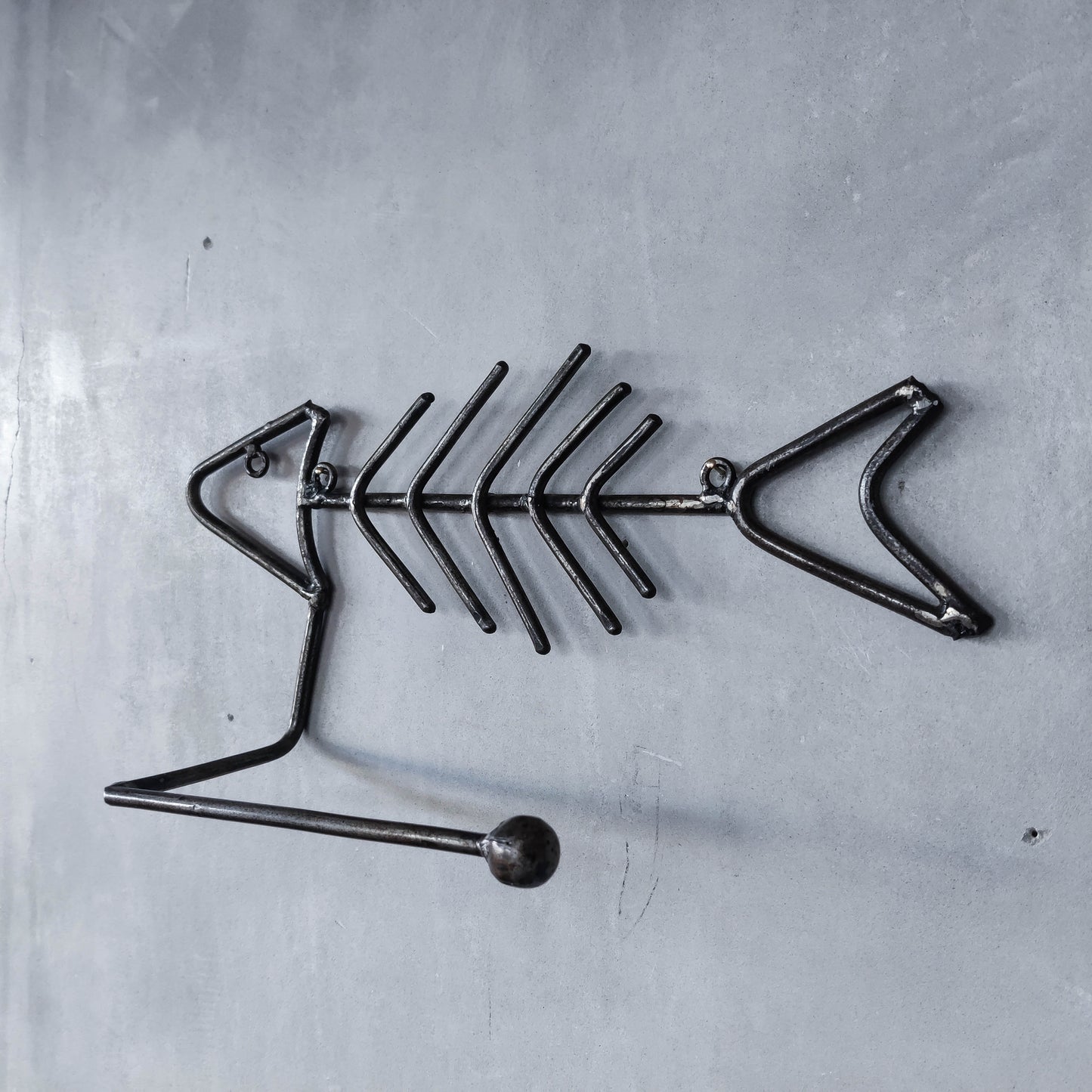 Vintage artisan made metalwork welded steel fish skeleton toilet roll holder