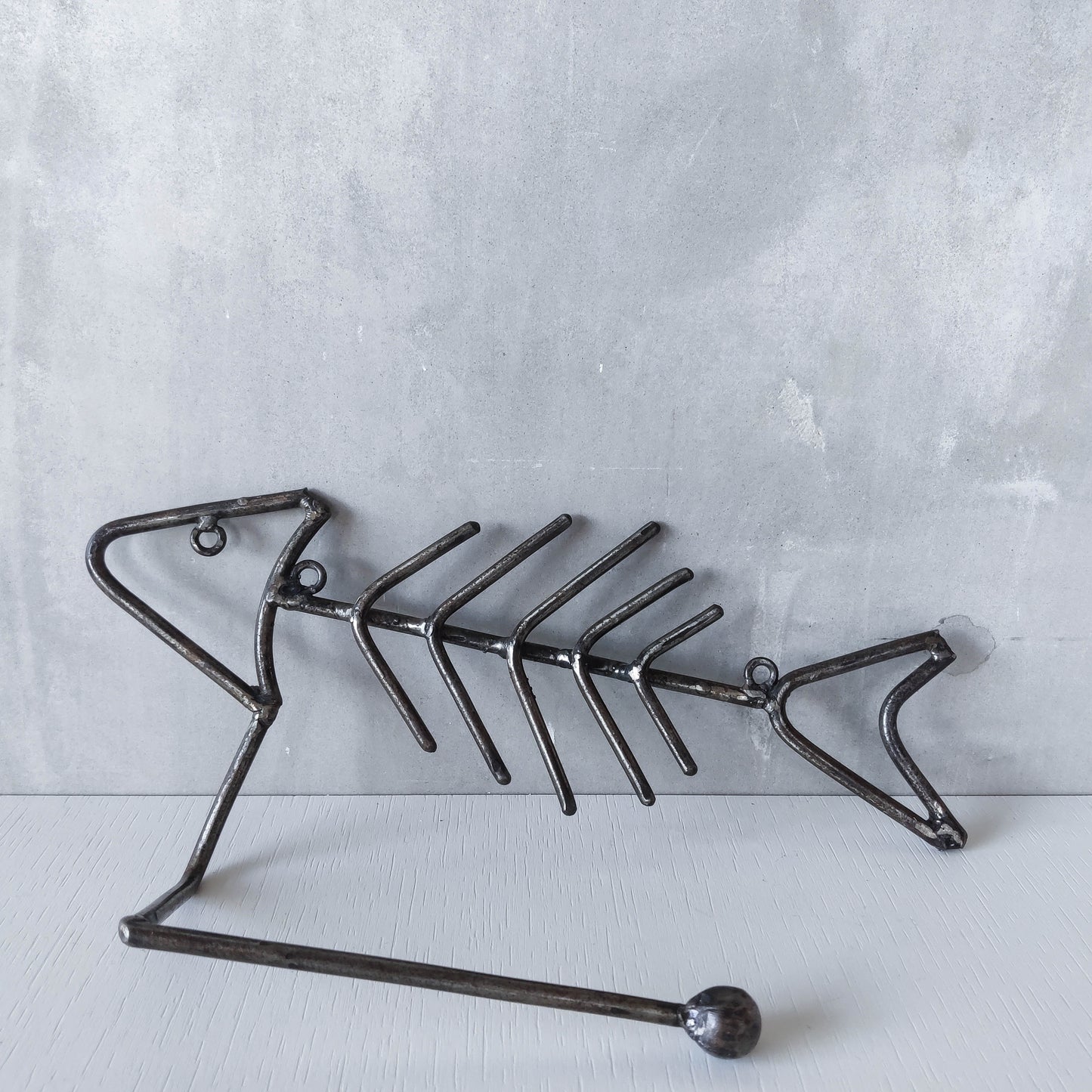 Vintage artisan made metalwork welded steel fish skeleton toilet roll holder