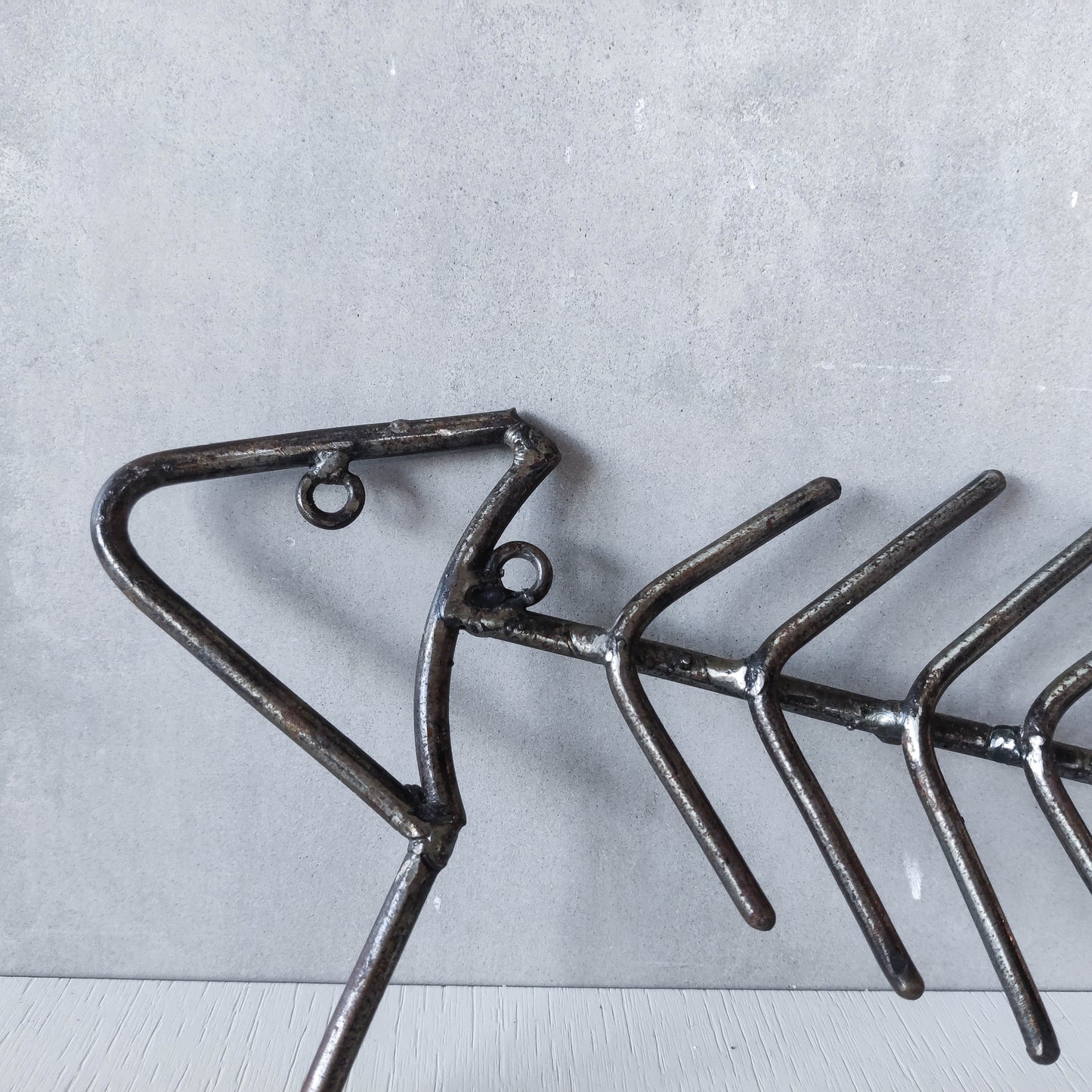 Vintage artisan made metalwork welded steel fish skeleton toilet roll holder