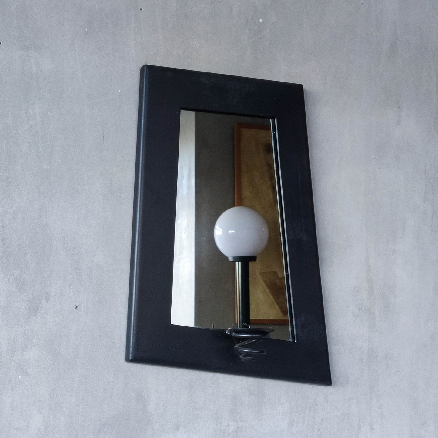 1990s handmade steel metalwork asymmetric mirror with candle sconce