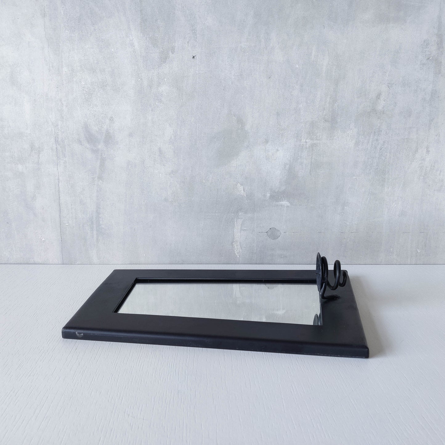 1990s handmade steel metalwork asymmetric mirror with candle sconce