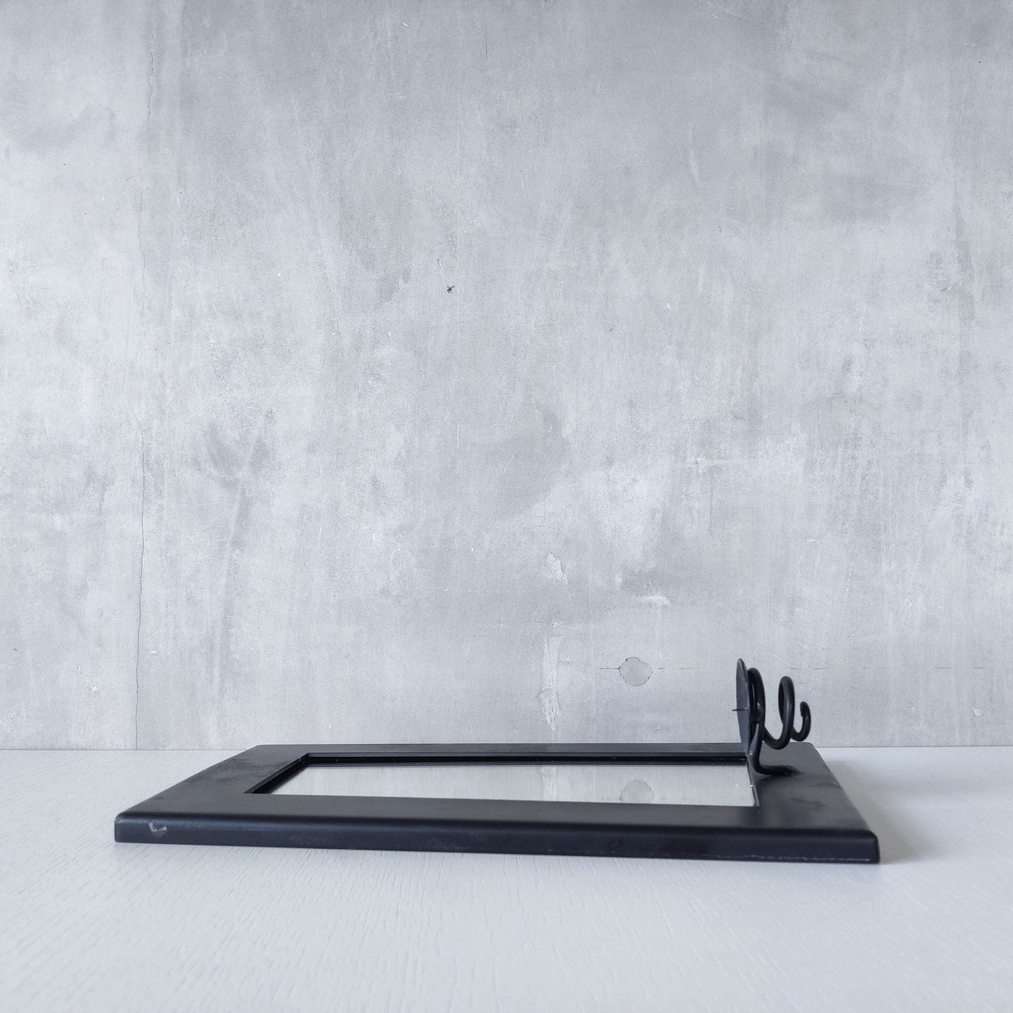 1990s handmade steel metalwork asymmetric mirror with candle sconce