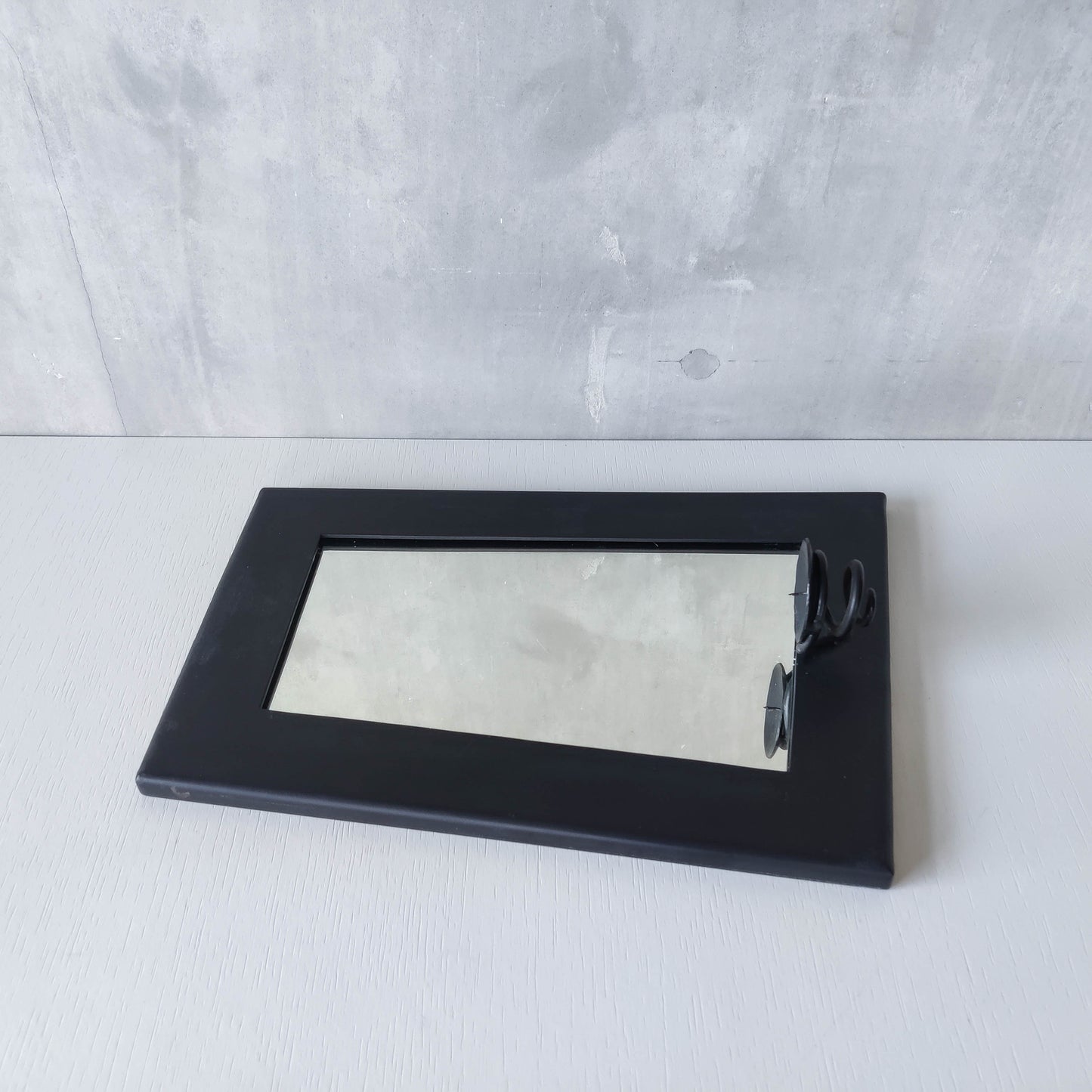 1990s handmade steel metalwork asymmetric mirror with candle sconce