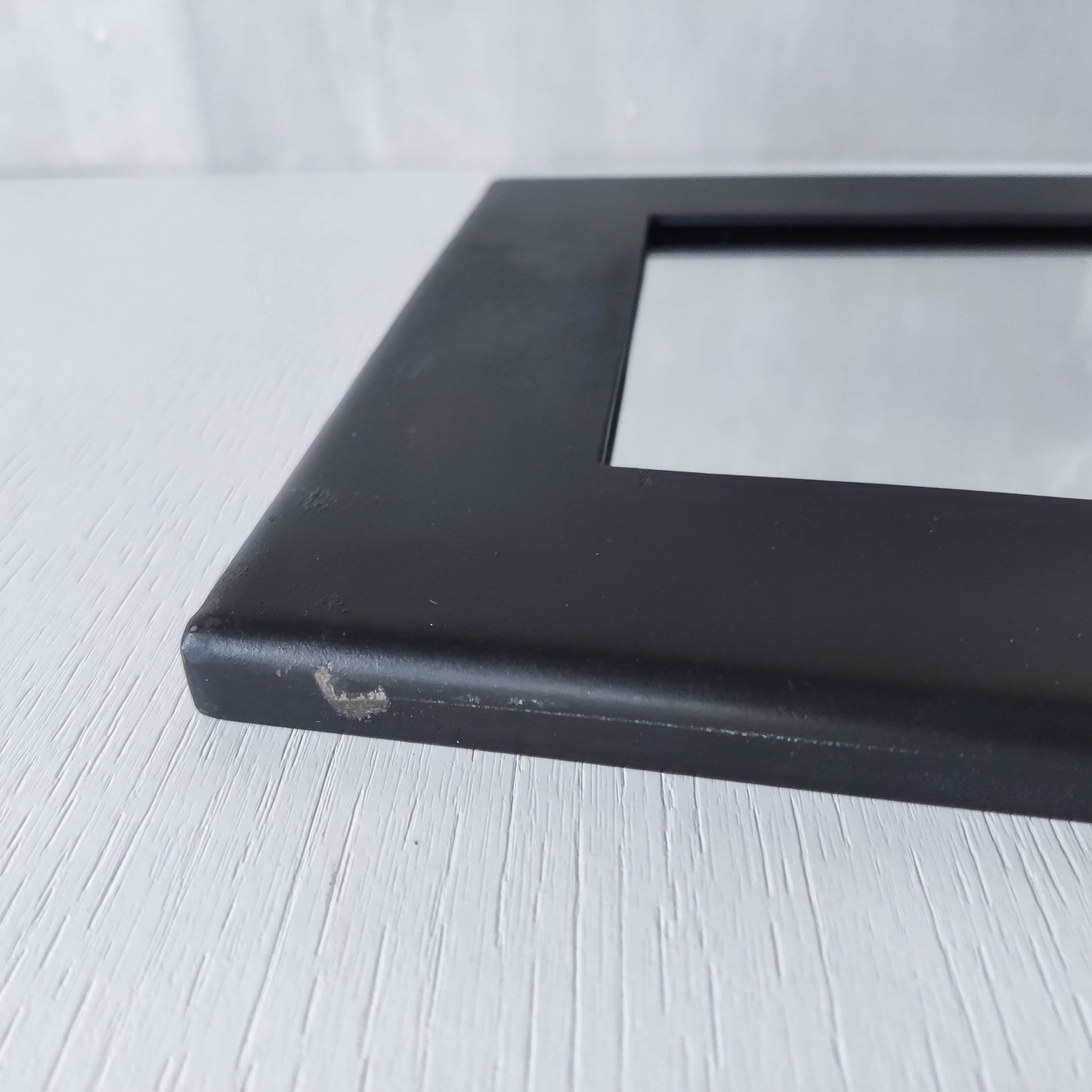 1990s handmade steel metalwork asymmetric mirror with candle sconce