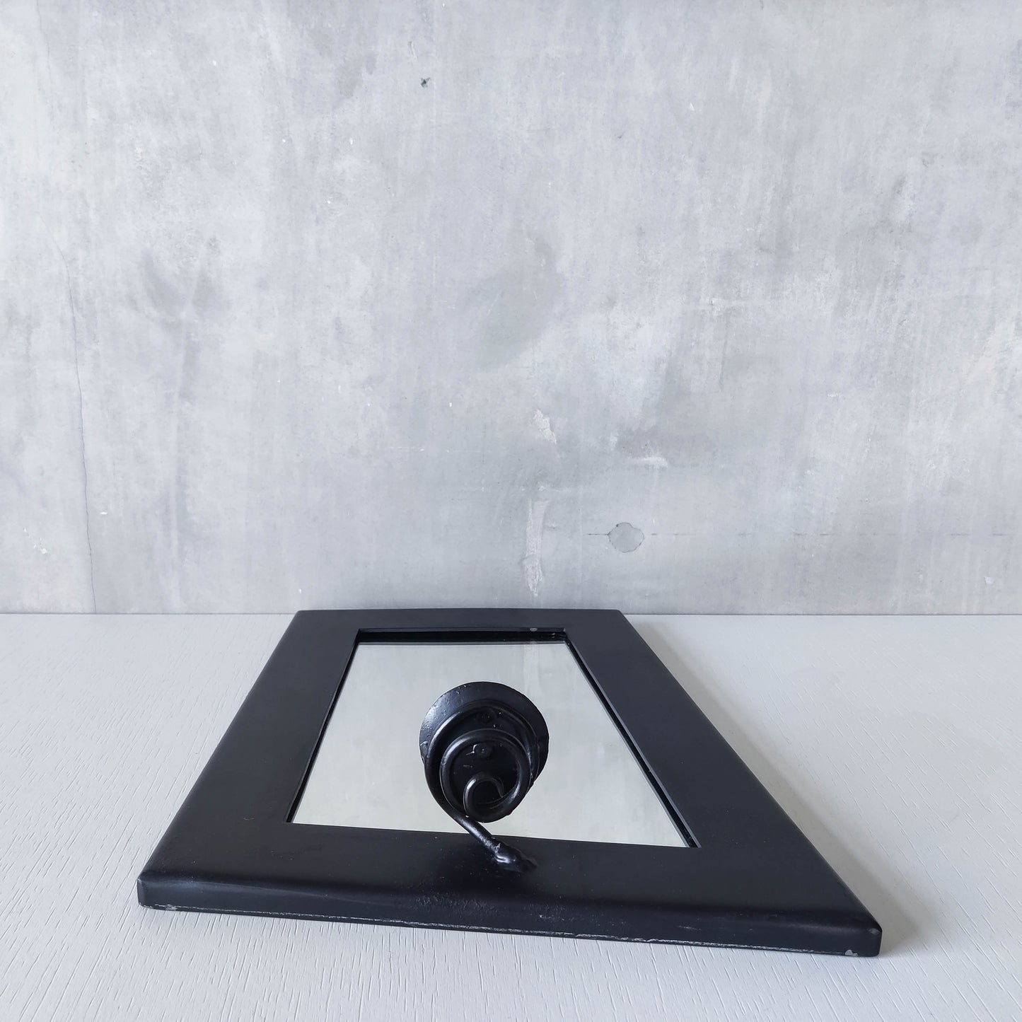 1990s handmade steel metalwork asymmetric mirror with candle sconce