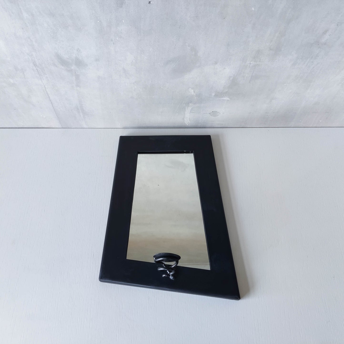 1990s handmade steel metalwork asymmetric mirror with candle sconce