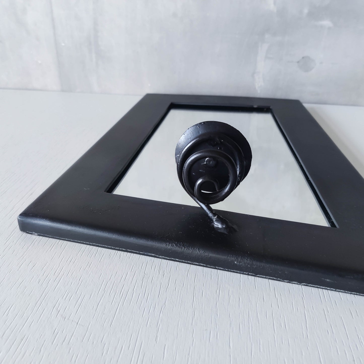 1990s handmade steel metalwork asymmetric mirror with candle sconce