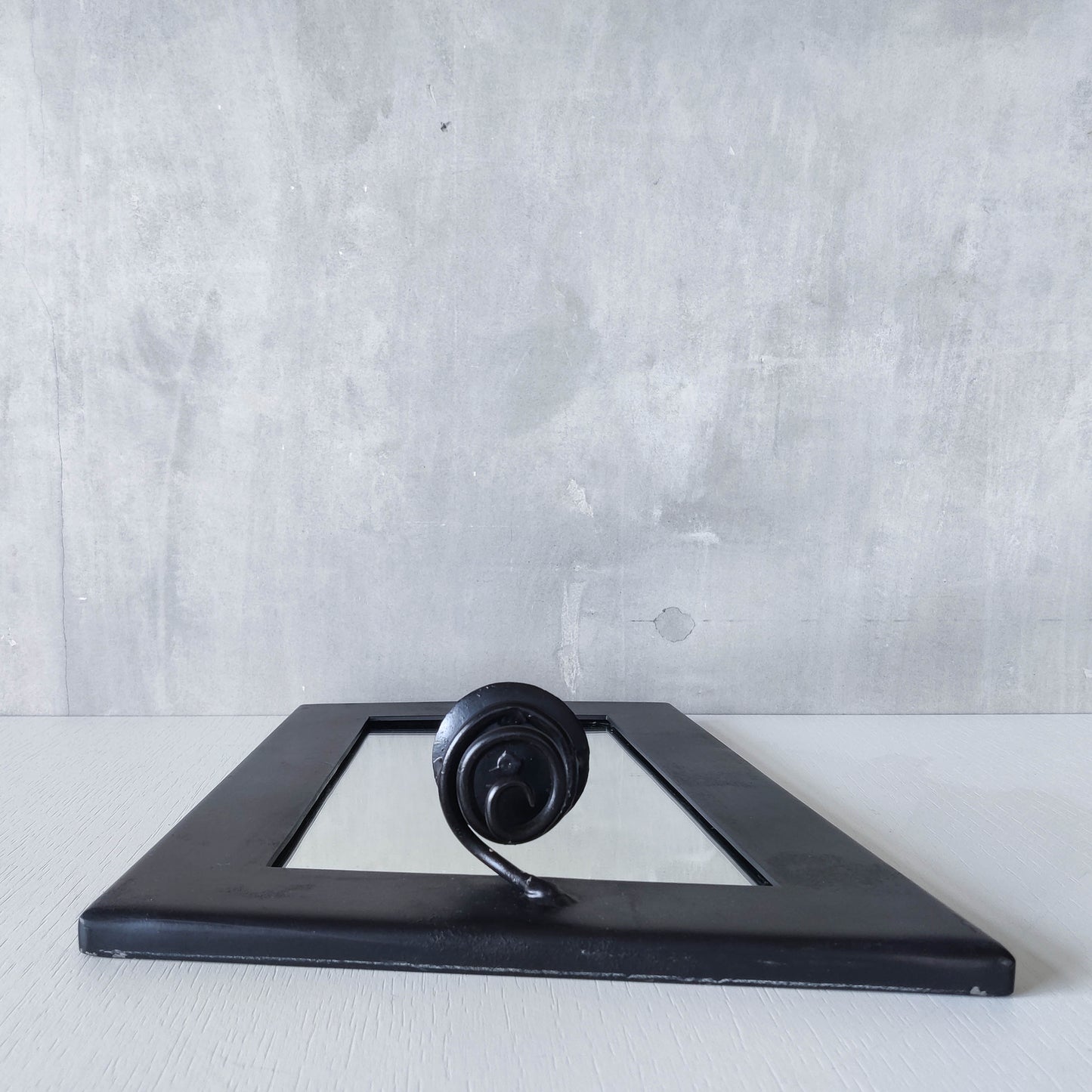 1990s handmade steel metalwork asymmetric mirror with candle sconce