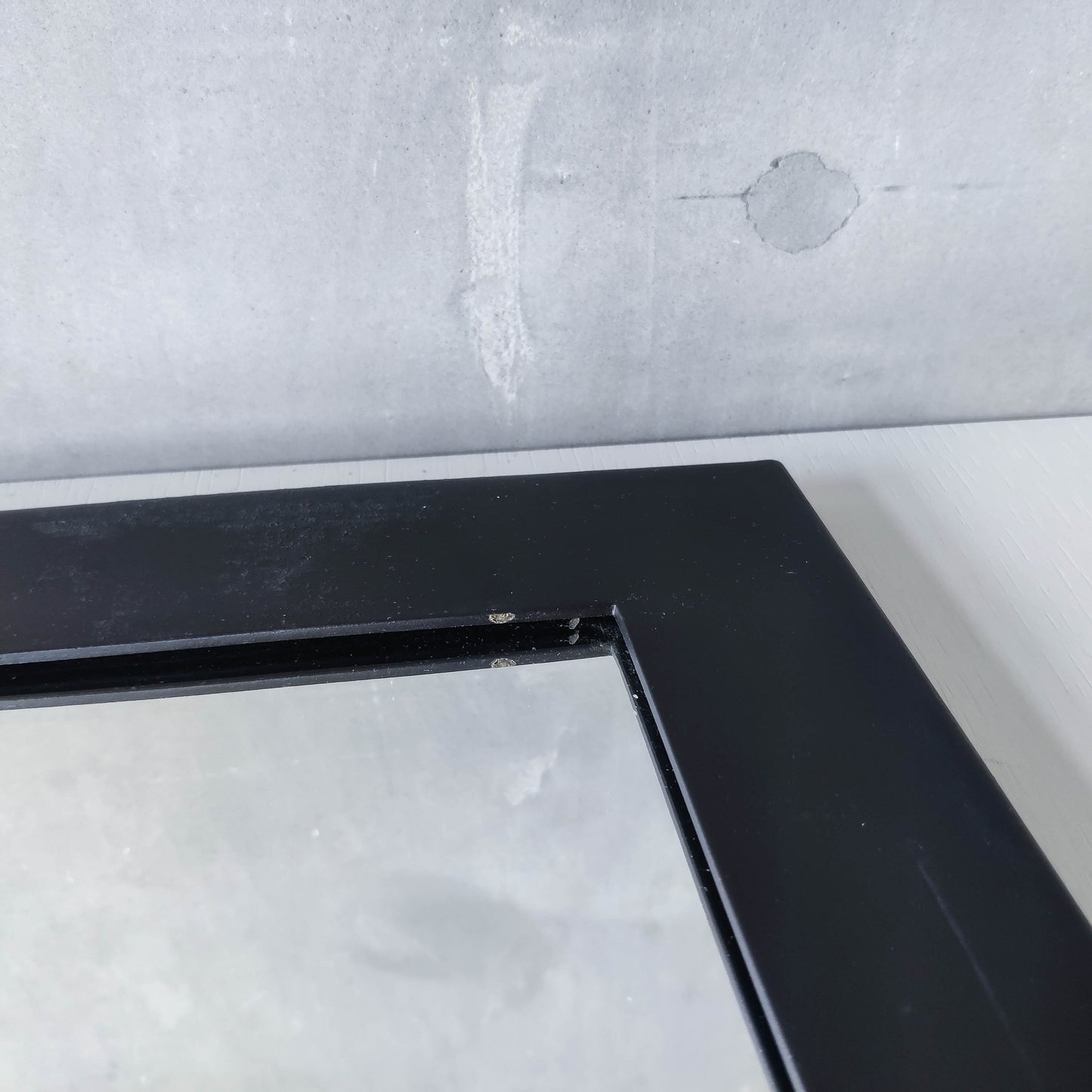 1990s handmade steel metalwork asymmetric mirror with candle sconce