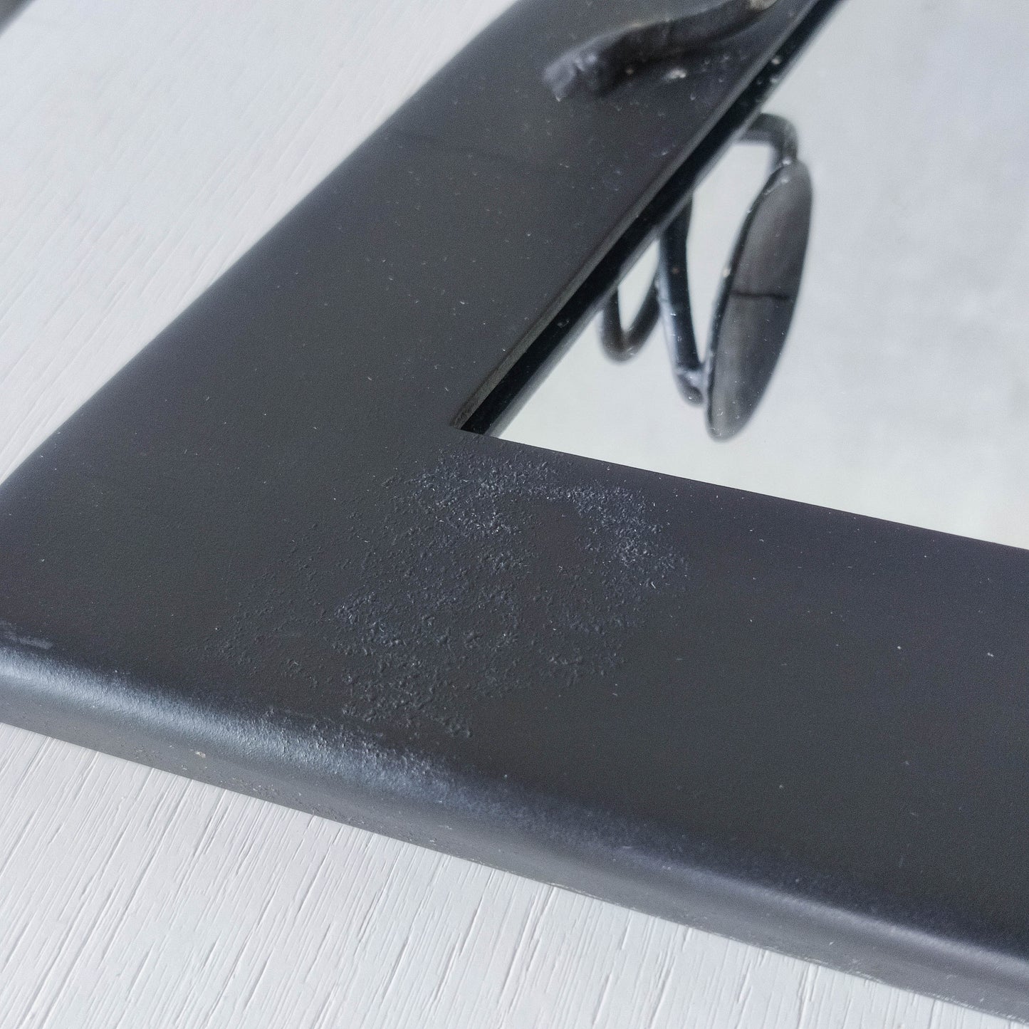 1990s handmade steel metalwork asymmetric mirror with candle sconce