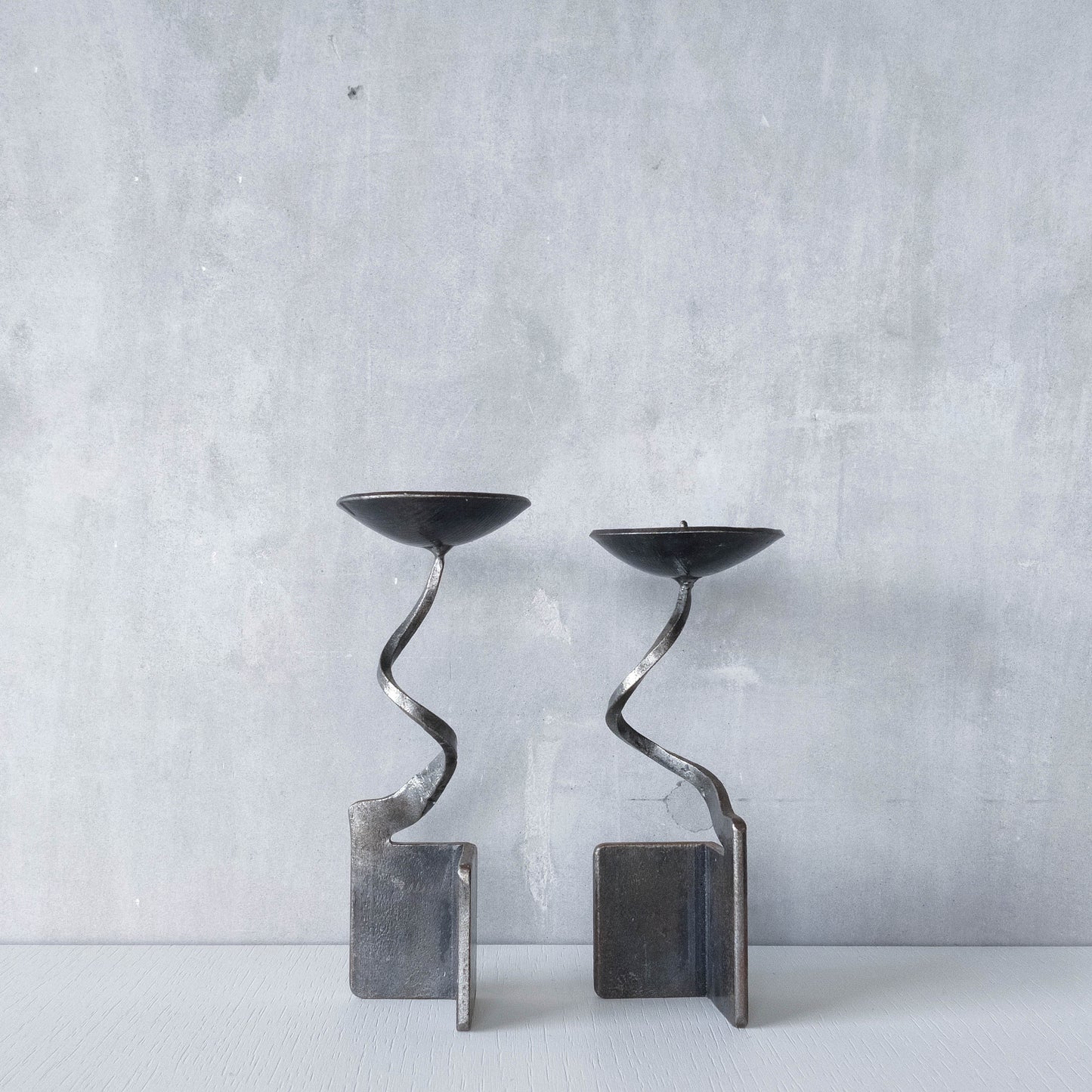 Pair of brutalist style metalwork forged steel sculptural candle holders