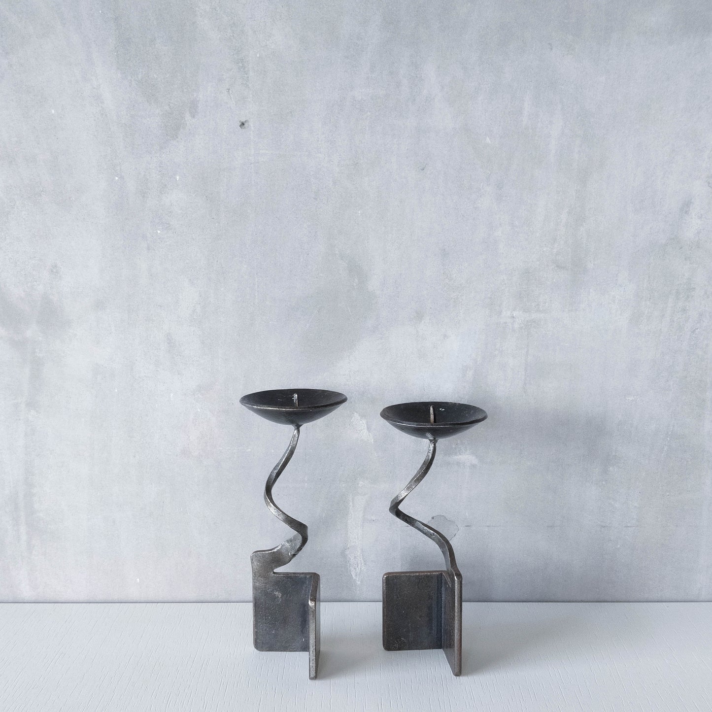 Pair of brutalist style metalwork forged steel sculptural candle holders