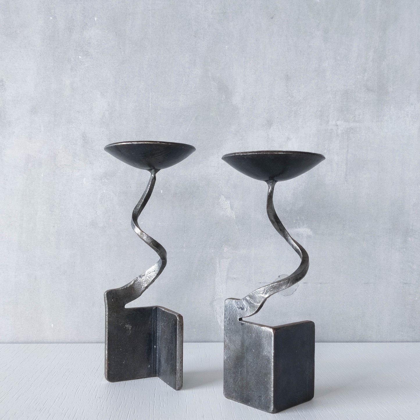 Pair of brutalist style metalwork forged steel sculptural candle holders