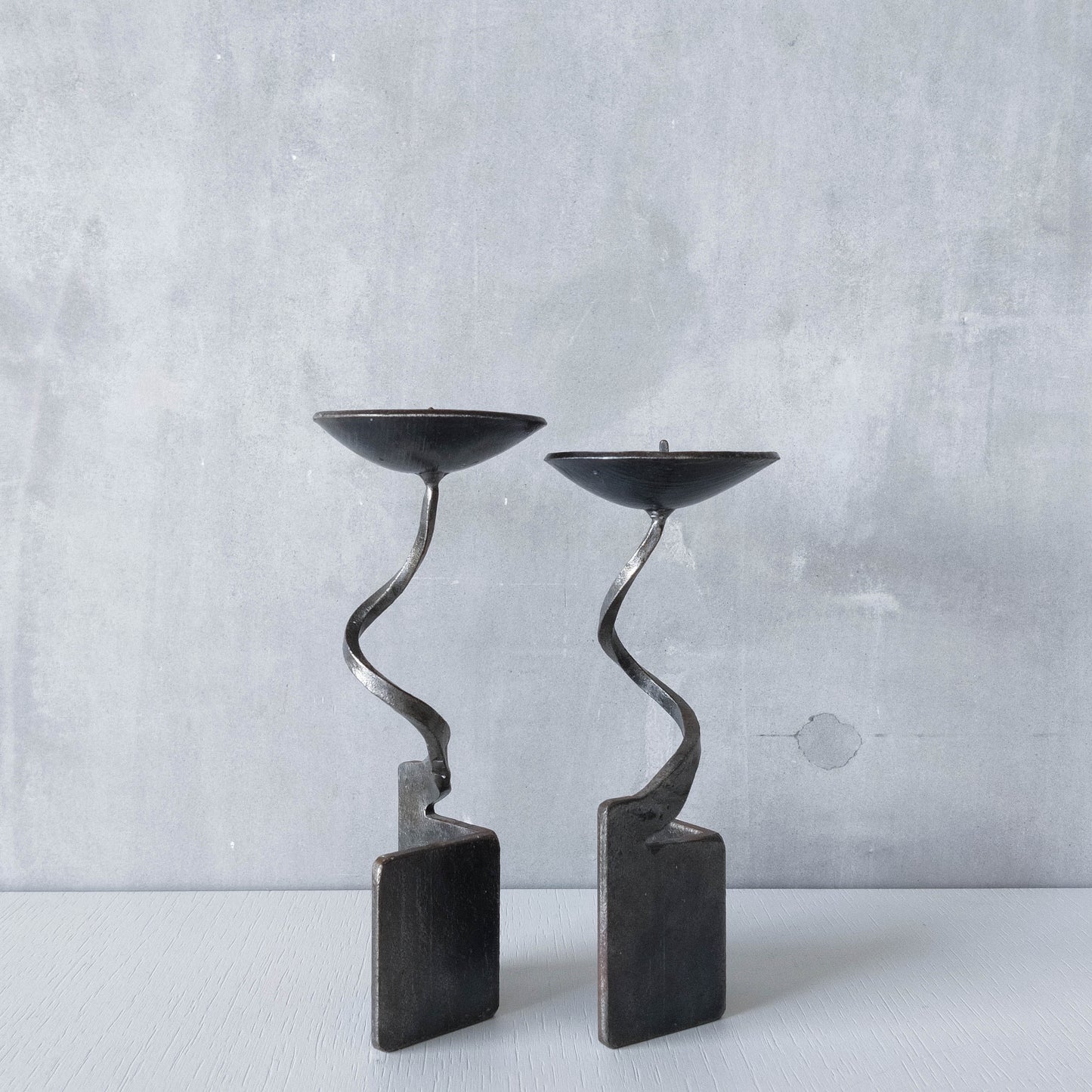 Pair of brutalist style metalwork forged steel sculptural candle holders