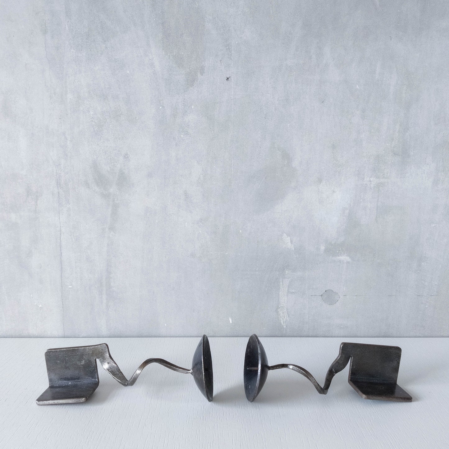 Pair of brutalist style metalwork forged steel sculptural candle holders