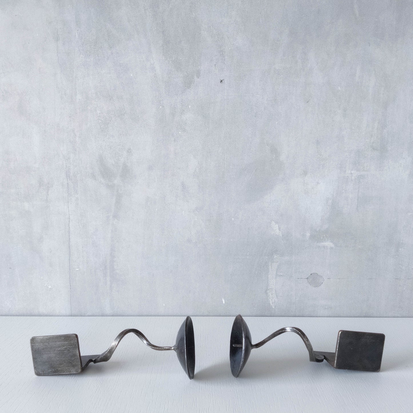 Pair of brutalist style metalwork forged steel sculptural candle holders