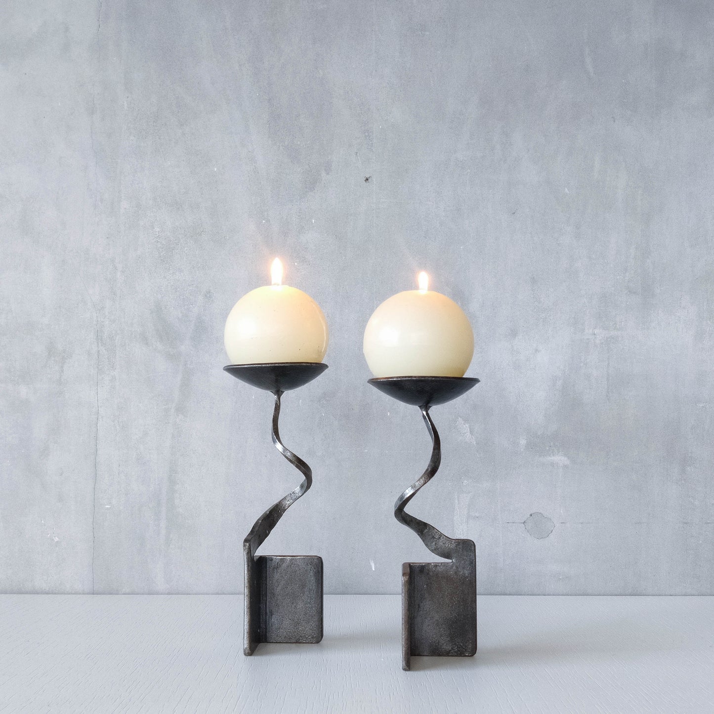 Pair of brutalist style metalwork forged steel sculptural candle holders