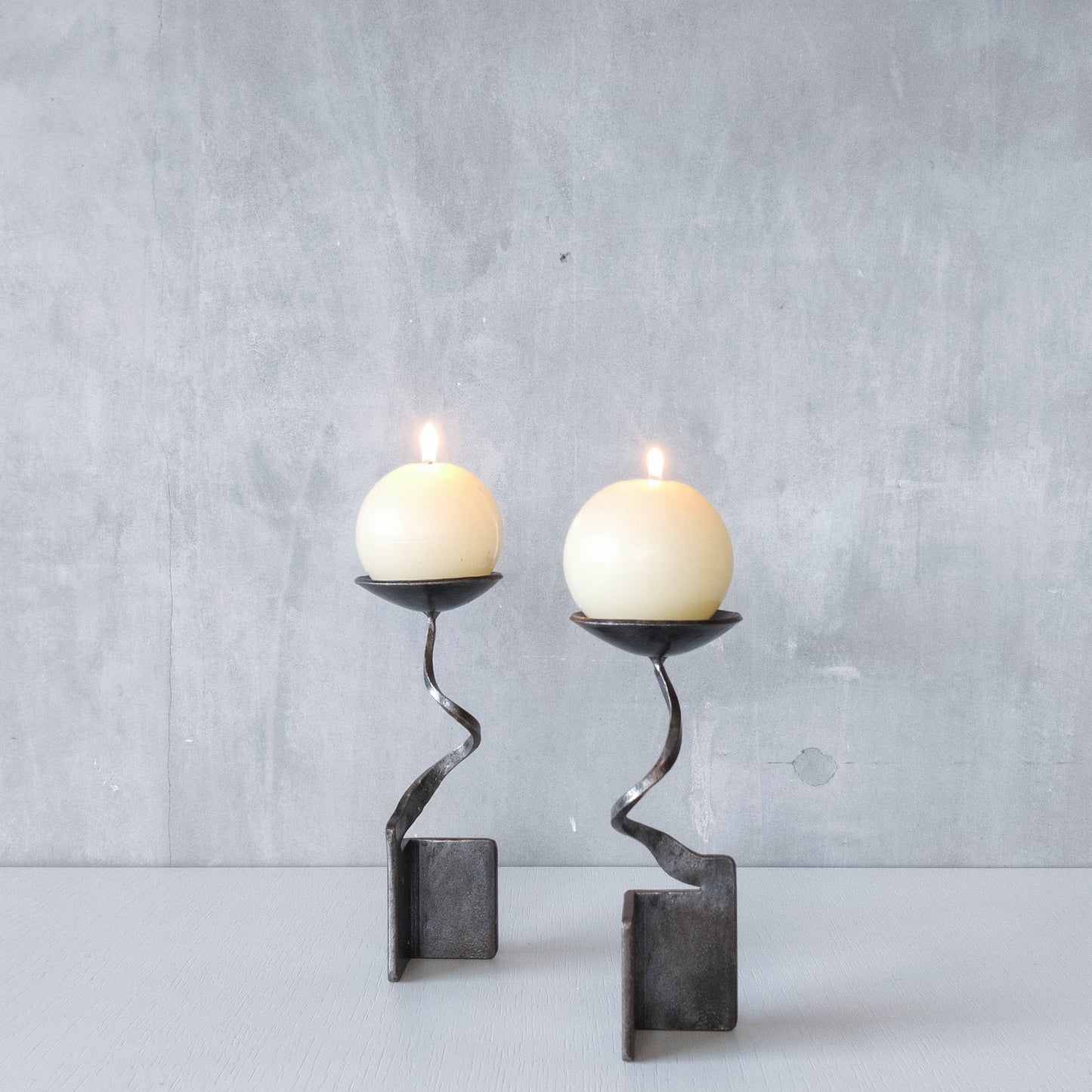 Pair of brutalist style metalwork forged steel sculptural candle holders