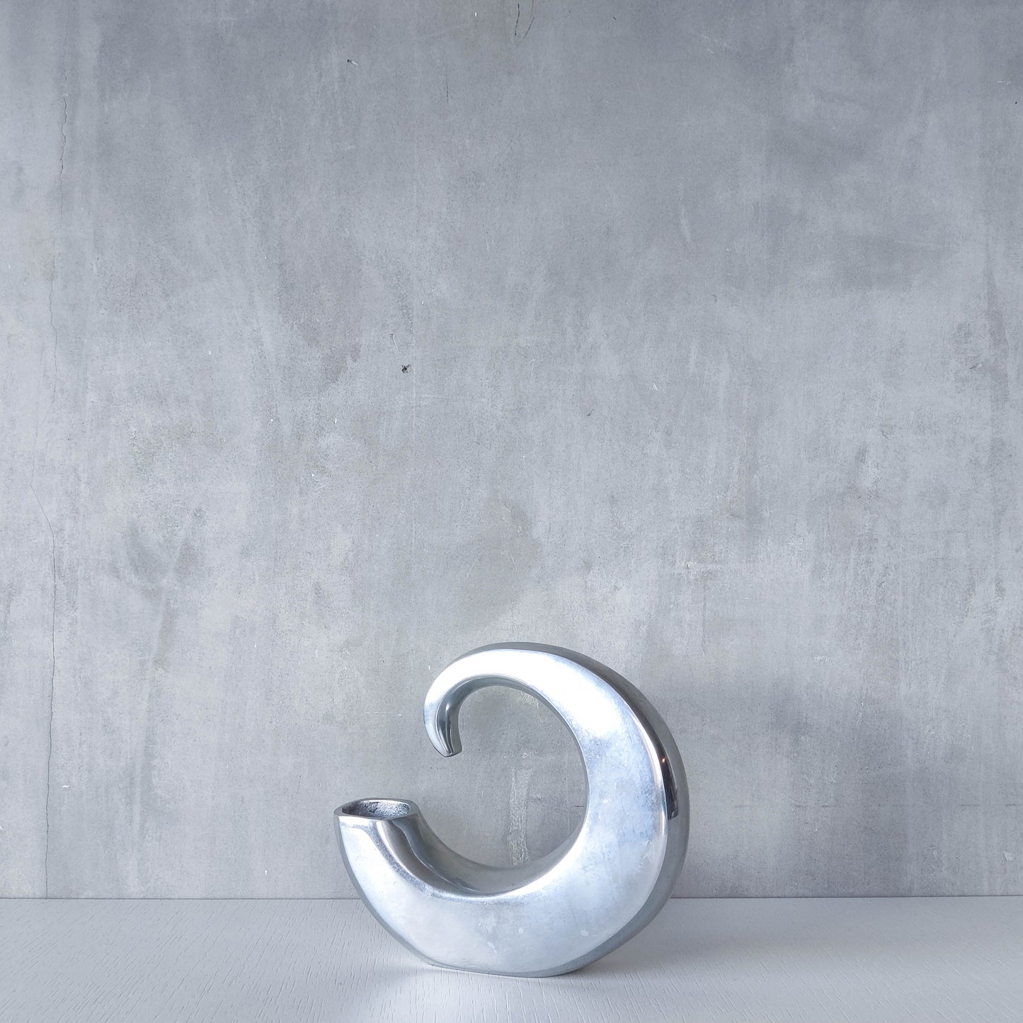 Vintage 1990s cast aluminium curved C shaped sculptural vase signed