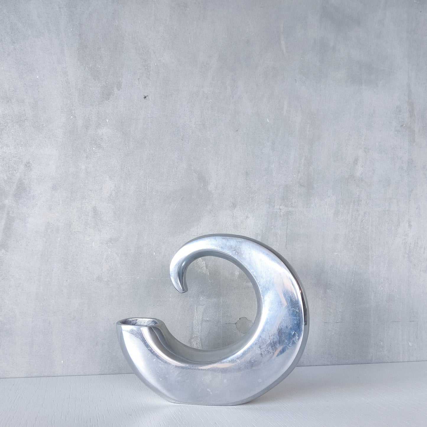 Vintage 1990s cast aluminium curved C shaped sculptural vase signed